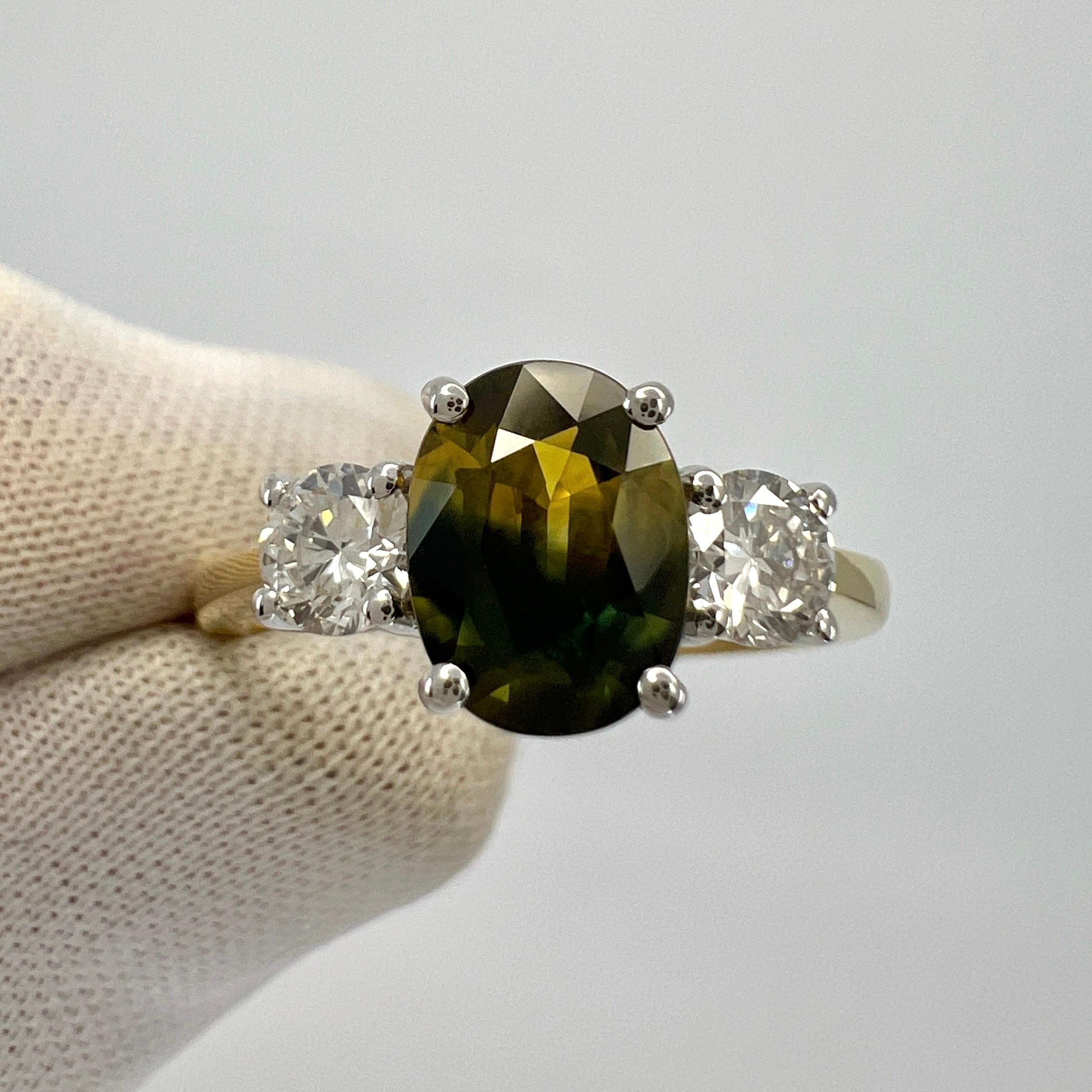 Unique GIA Certified Australian Yellow Green Blue Parti Colour Sapphire And Diamond Three Stone 18k Multi Tone Gold Ring. 
2.01 Total Carat.

GIA Certified 1.51 Carat centre Australian sapphire with a unique parti colour effect.  Fascinating and