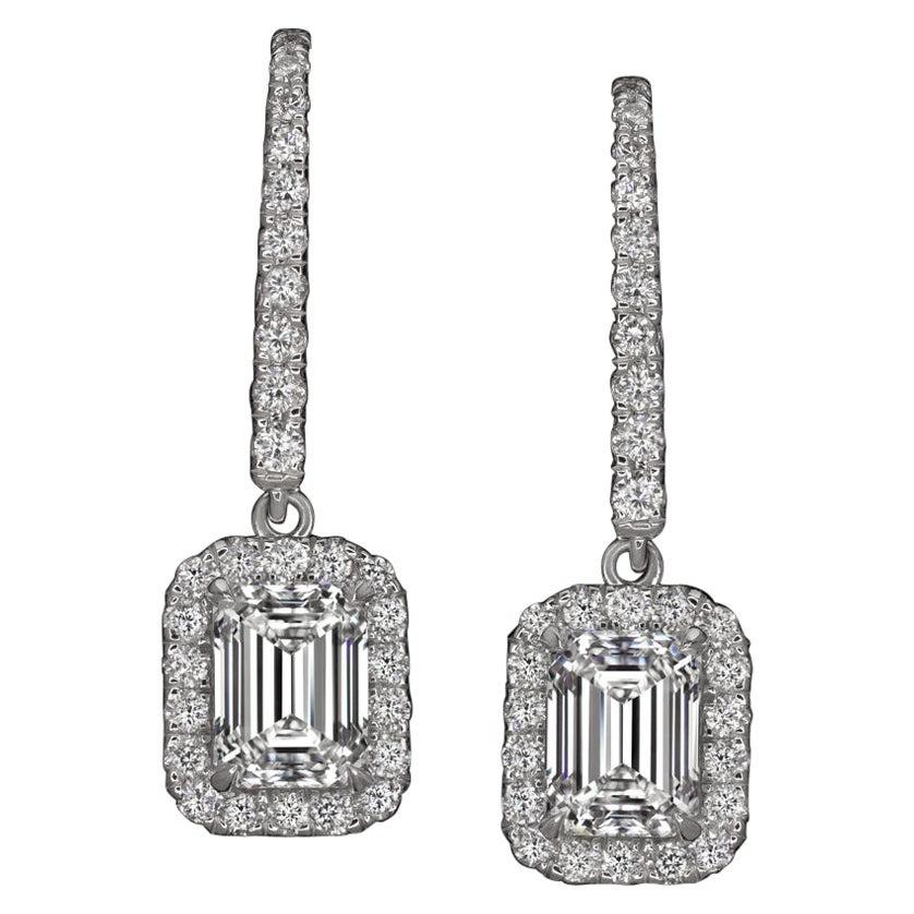 This amazing pair of emerald cut dangle earrings by Antinori Di Sanpietro features emerald cut diamonds weighting 1.01 carats each. They are set on a white gold mounting with pave diamonds down the wire. The two diamonds are certified by the GIA,