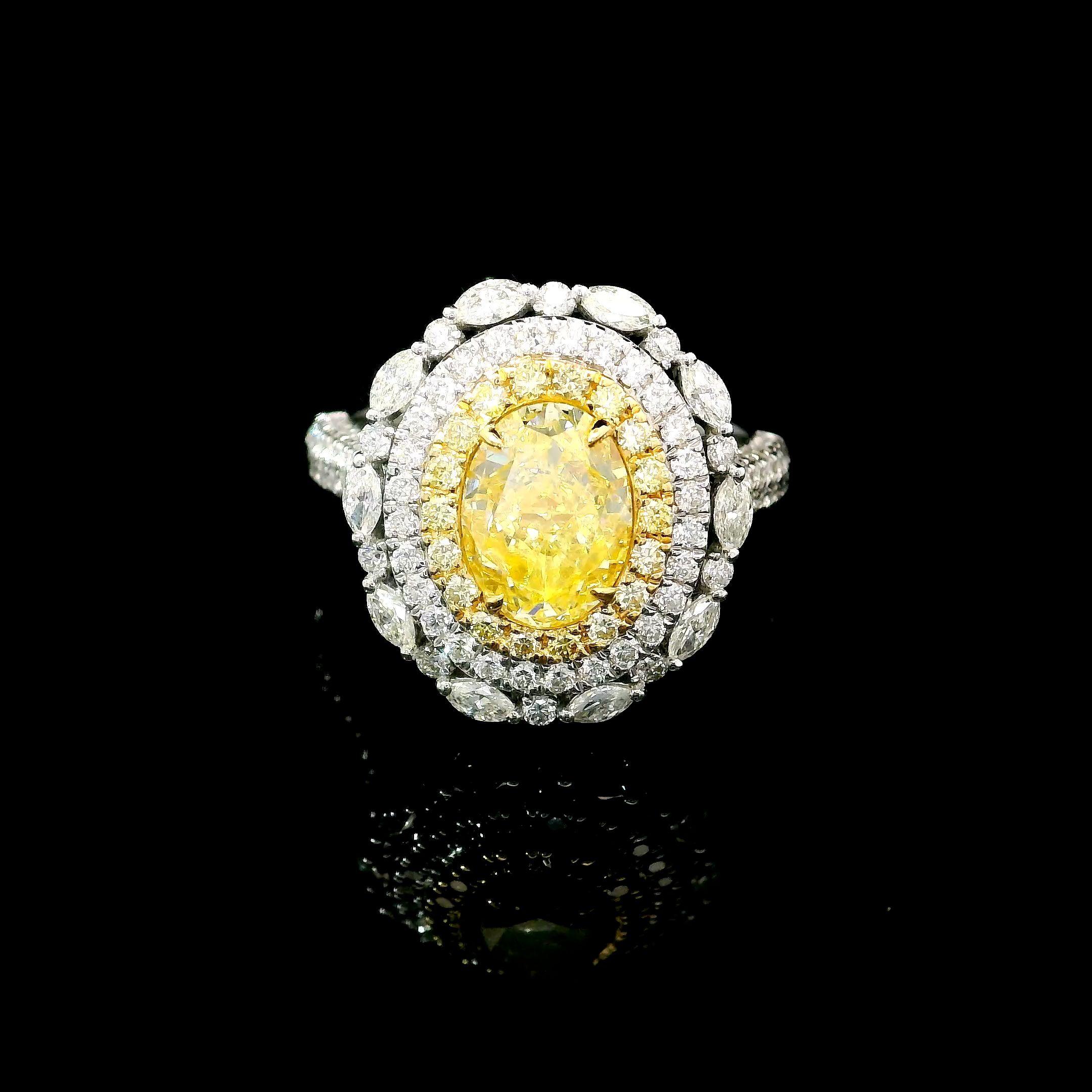 18kt white gold ring with diamonds
  
  Gold colour & karat: White gold 18kt
  Weight: 5.73 grams
  
  Set with-
  Stone type: Diamonds
  Shape: Oval
  Carat: 2.02 ct
  Colour: Fancy Yellow
  Clarity: I2
  
  Surrounding Stones: Diamonds
 1) White