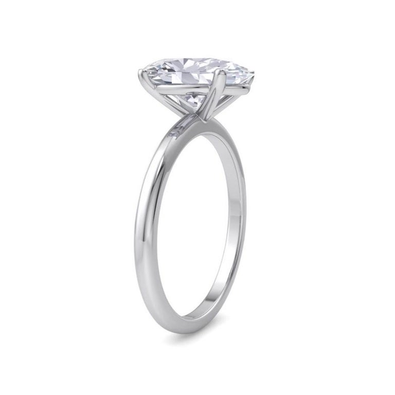 Handcrafted Solitaire Engagement Ring centers a 2.02 Carat oval cut diamond  E / VVS1 and mounted on 18K White Gold. 
Oval Diamond dimensions: 10.01 mm x 6.98 mm x 4.28 mm
Ring Size 6.5 and can be resized. 
*Our ring is custom made. Since beautiful
