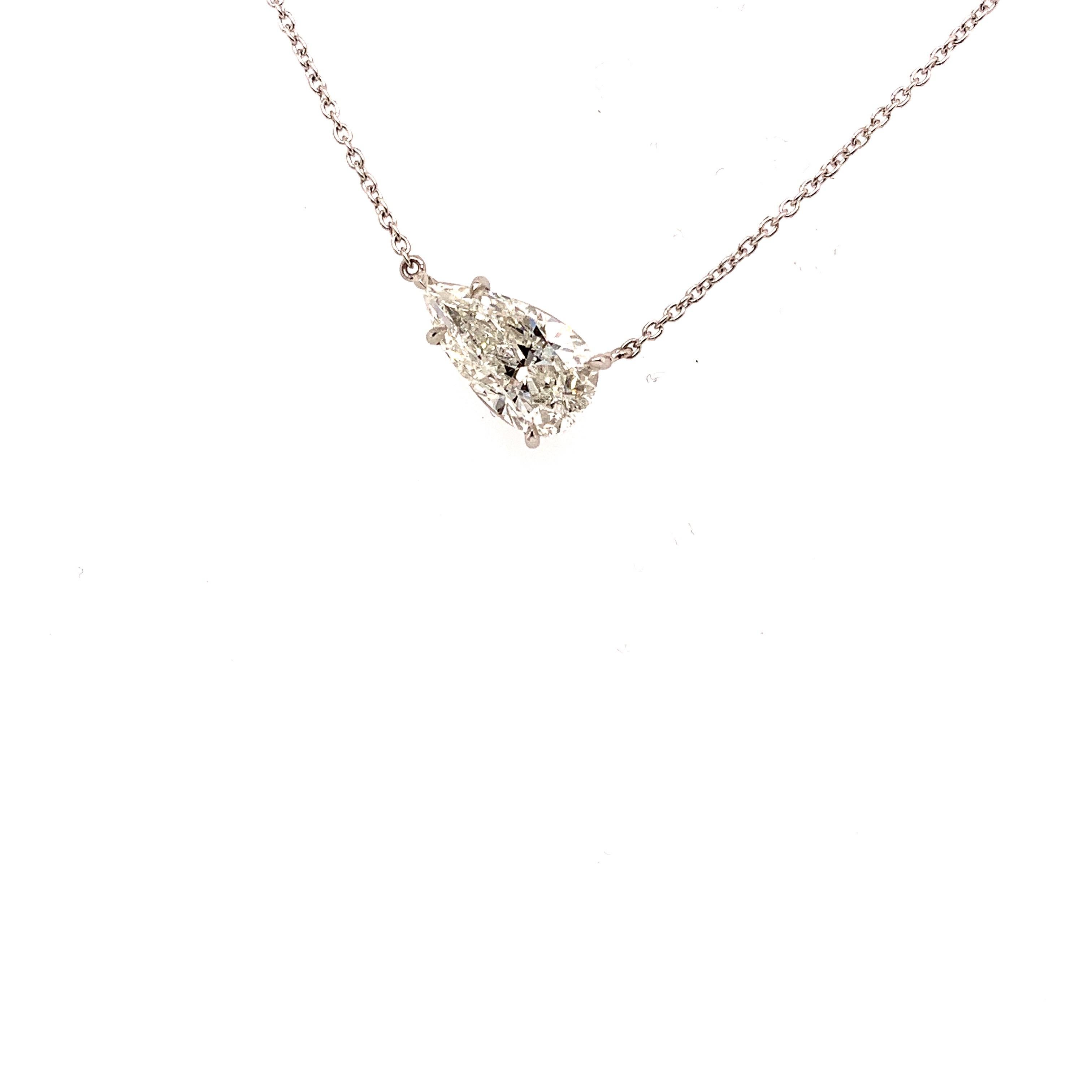 This stunning pendant necklace set in Italian hand made platinum. featuring a charming pear shape diamond, weighing 2.02 carats. Graded by the GIA I color SI2 clarity.
Newest look in pendants - the Diamond sits asymmetrical. 
The stone is set in a