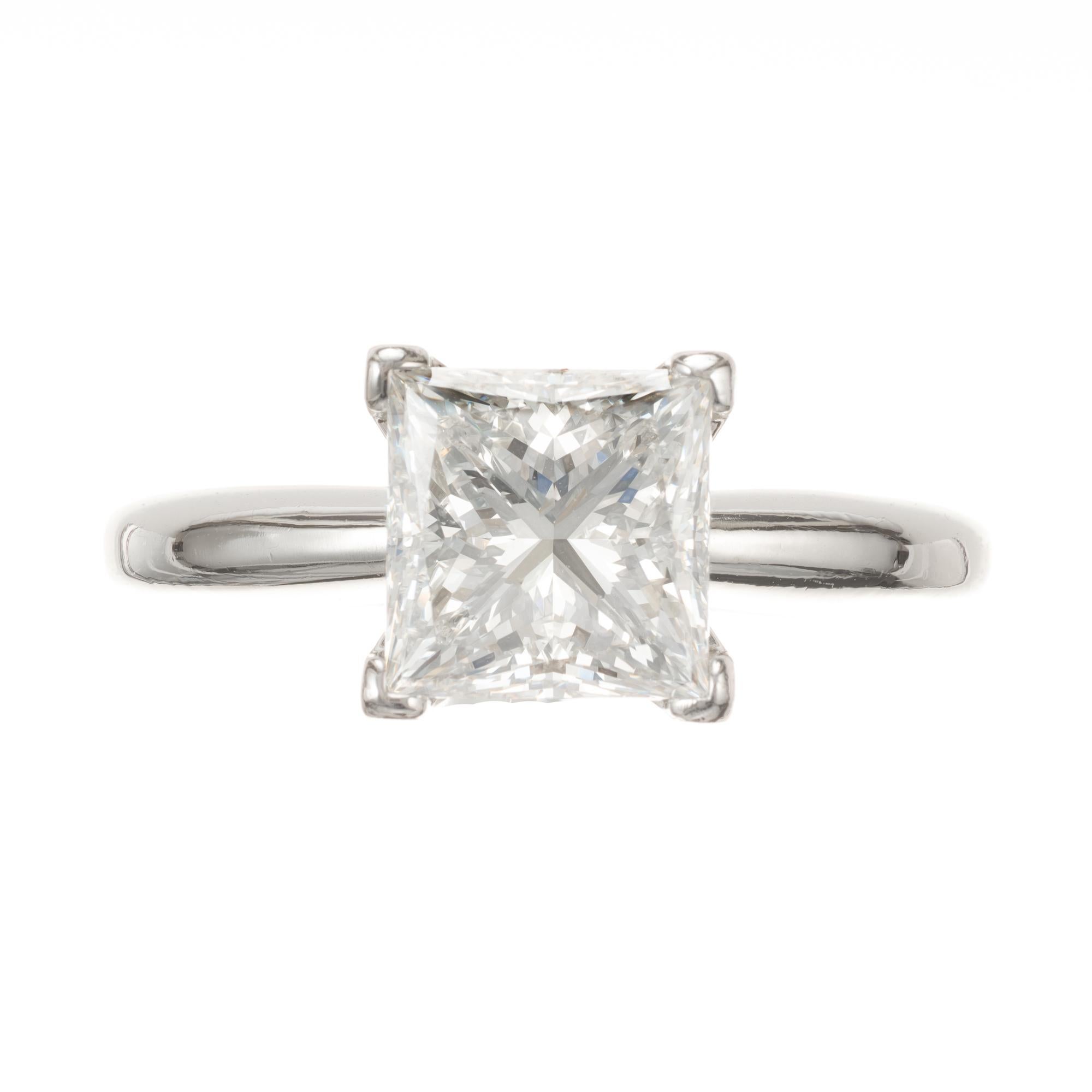 Princess cut diamond solitaire engagement ring. Platinum simple solitaire settling with square prongs in each corner to keep the shape appearing square and showing as much of the diamond as possible. 

1 Princess cut diamond 2.02cts, I, VS1, GIA