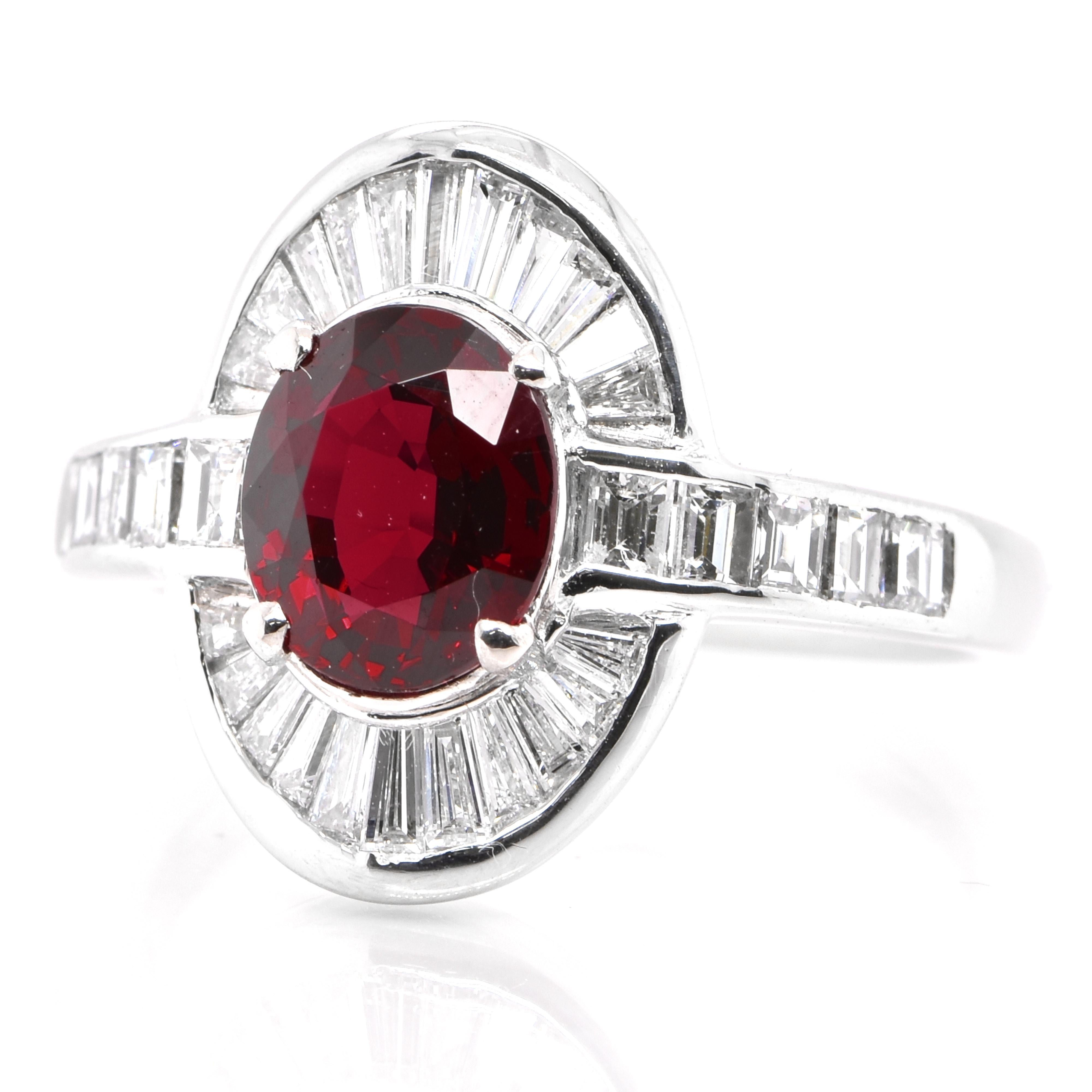 A beautiful Estate Cocktail ring set in Platinum featuring a GIA Certified 2.03 Carat Natural Thailand Crimson Red Ruby and 0.92 Carats of Diamond Accents. Rubies are referred to as 