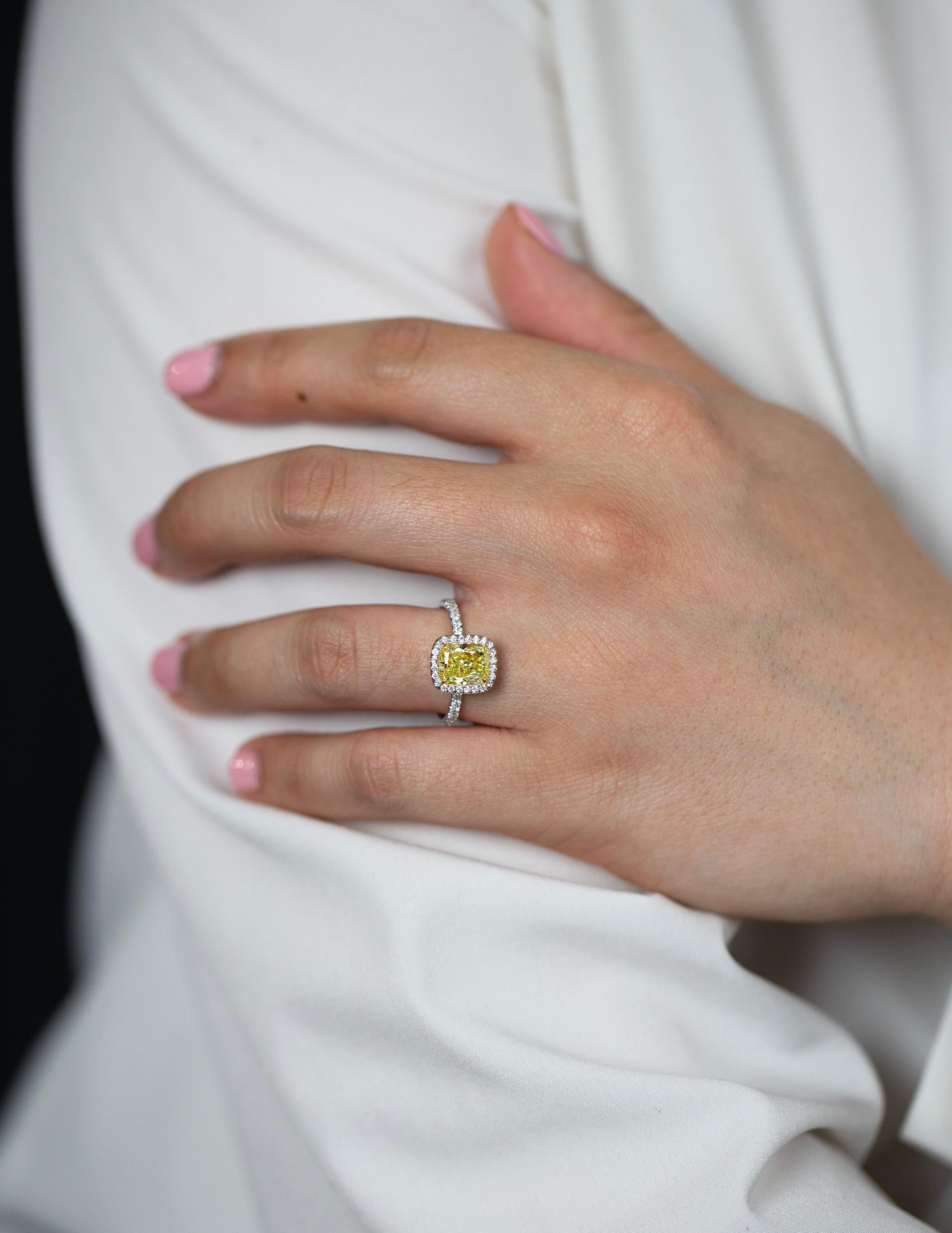 Women's GIA Certified 2.03 Carats Cushion Cut Fancy Yellow Diamond Halo Engagement Ring For Sale
