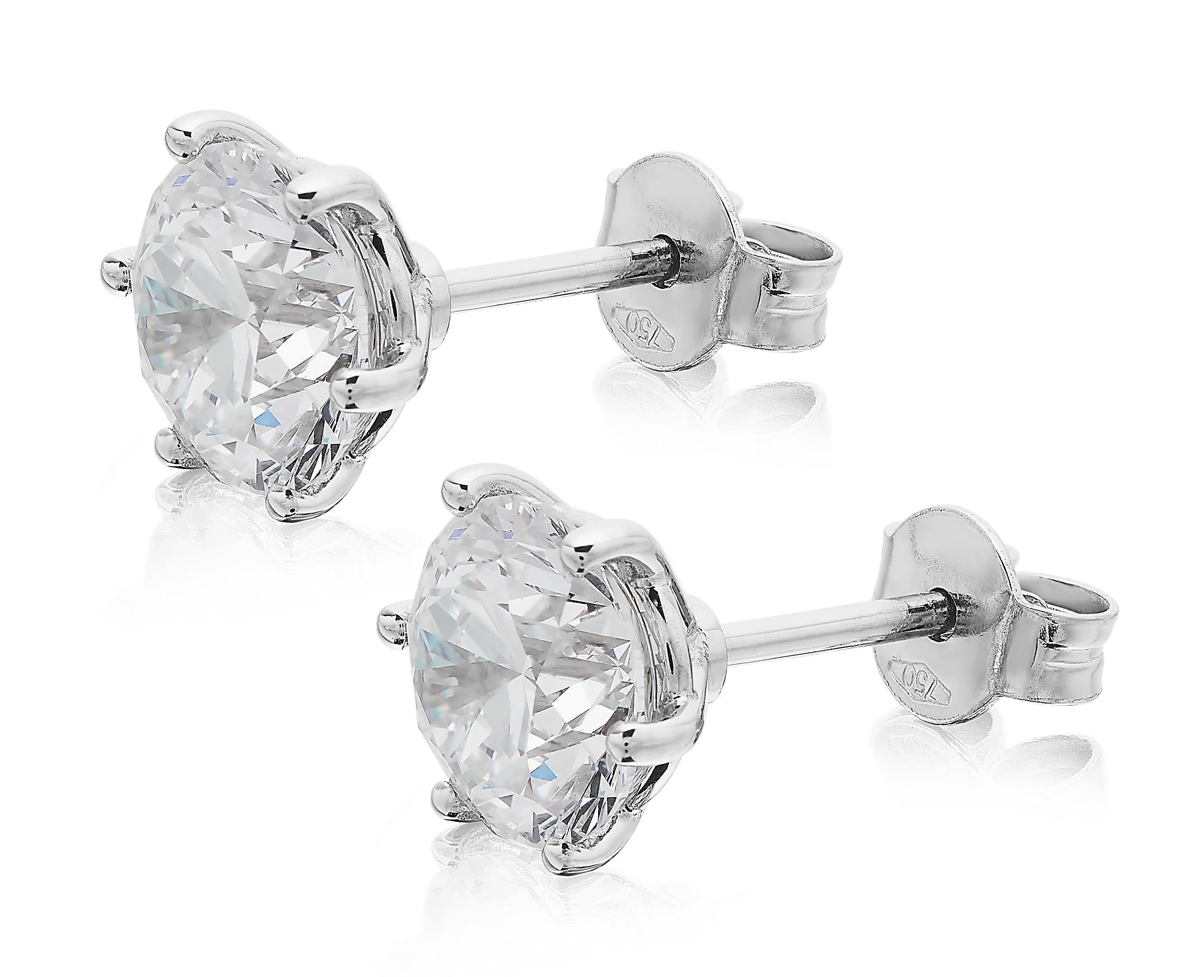 GIA Certified Solitaire Stud Diamond Earrings, featuring 2 GIA graded round brilliant cut diamonds 2.03 and 2.01 carats each, set in platinum specially handmade to fit upright upon any size of ears. Pin fitting with 18ct white gold butterfly spare