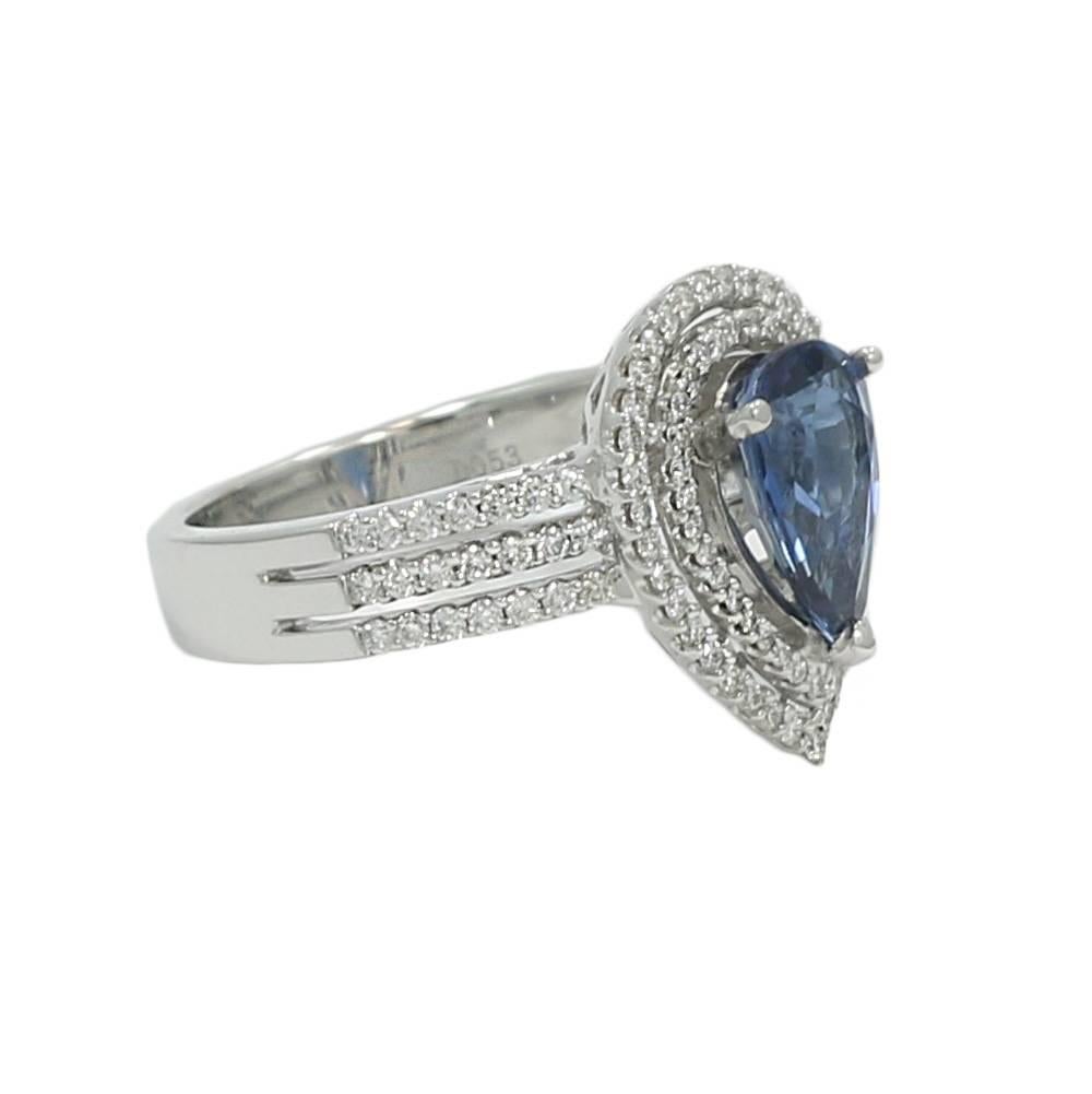 18K White Gold Double Halo Ring With Natural No Heat Pear Shape Sapphire On The Center. The Sapphire Weighs 2.04 Carat Total Weight and The 110 Diamonds H-VS Weigh 0.53 Carats Total Weight. The Sapphire Comes With A GIA Report. The Ring Sits At A