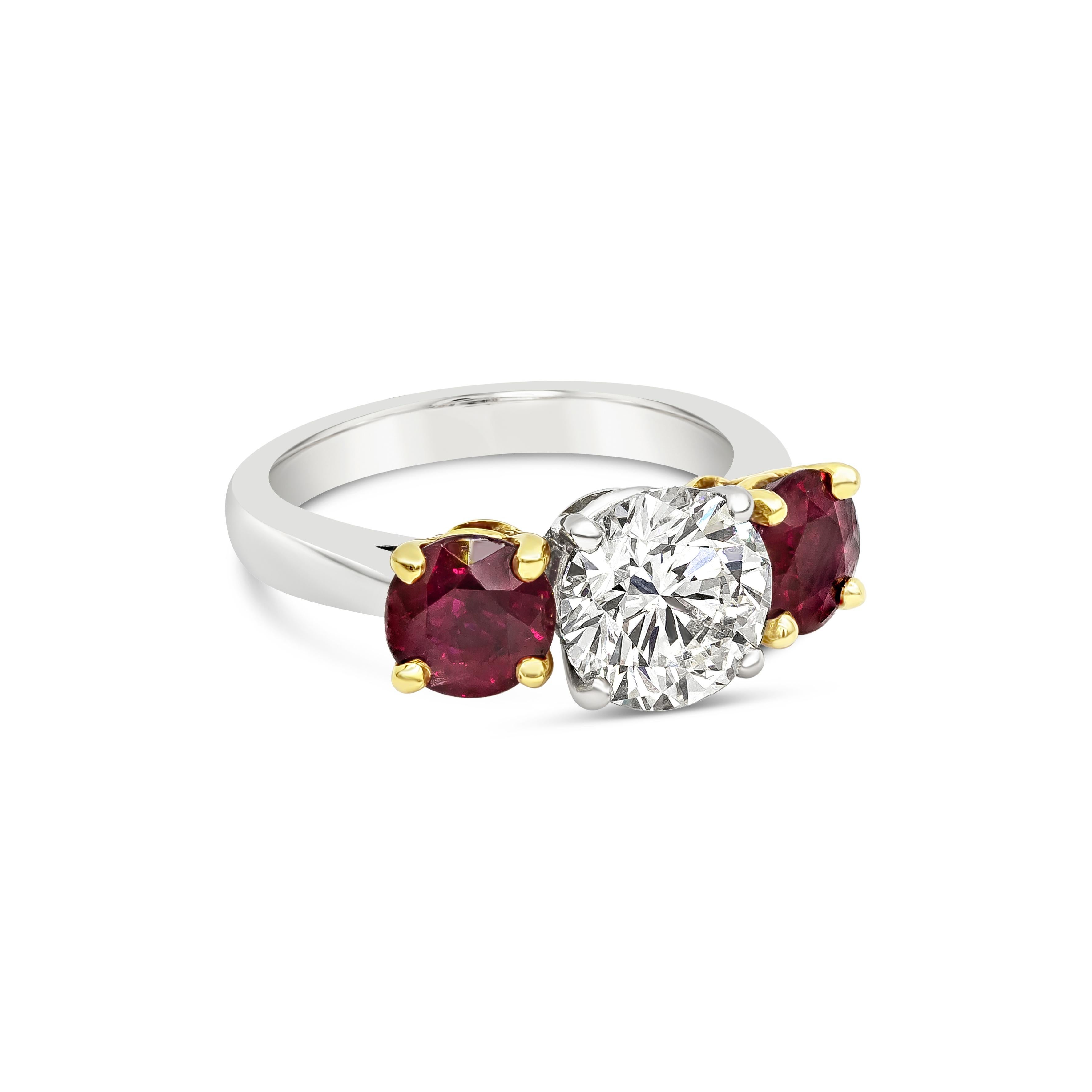 A well crafted three-stone engagement ring featuring a 2.04 carats brilliant round diamond certified by GIA as J color, VS2 in clarity. Flanking the center diamond are color-rich round rubies on each side weighing 2.14 carats total and set in a