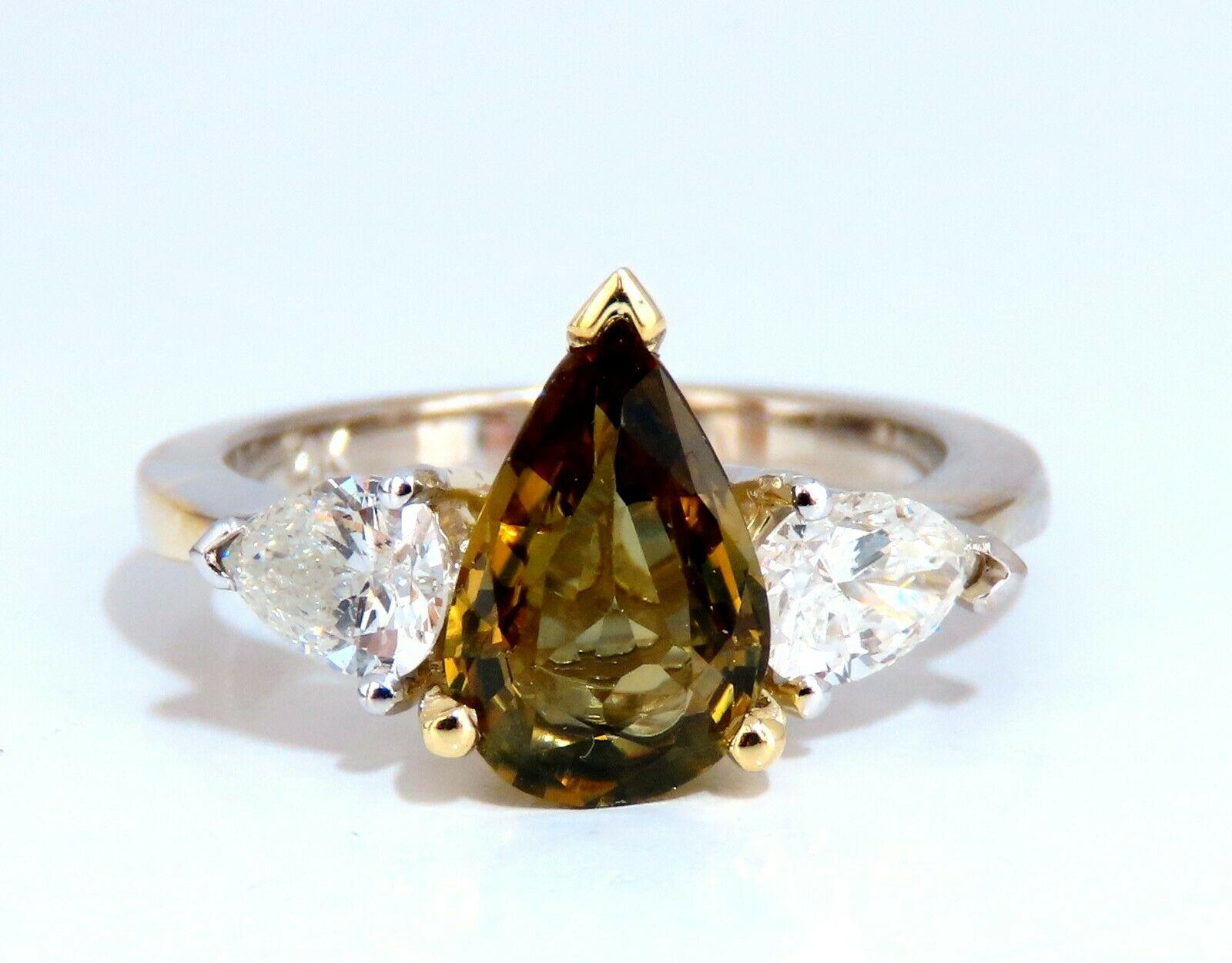 Classic Three Anniversary 

2.04ct. Natural GIA Certified Brown-Yellow Sapphire Ring

GIA Certified Report ID: 6352602820

10.66 X 7.08 X 3.34mm

Full cut Pear brilliant 

Clean Clarity & Transparent

.87ct. (2) Pear Cut Diamonds 

H-color Vs-2