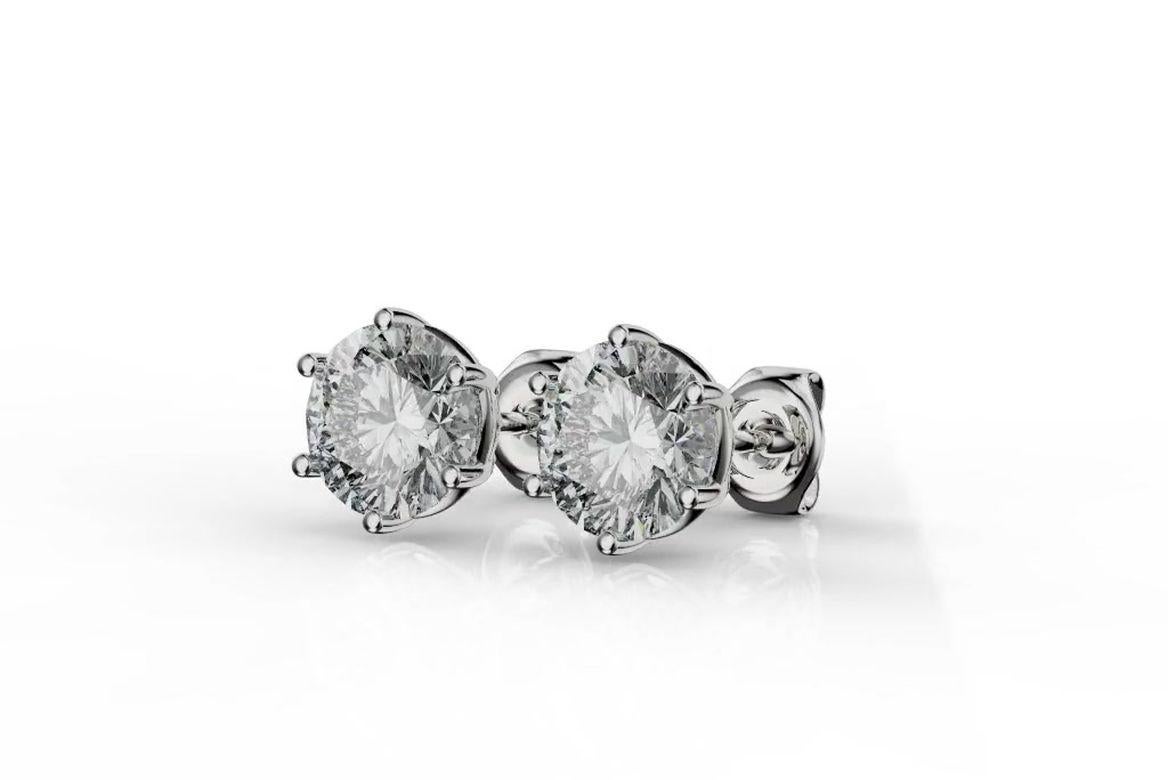 Handcrafted GIA Certified Diamond Stud Earrings featuring 2.05 Carat Total Diamond Weight G-H / SI2
Diamonds are set in 14K White Gold 6 prong setting. 

*** This specific jewel has been already sold. We will be happy to manufacture the same