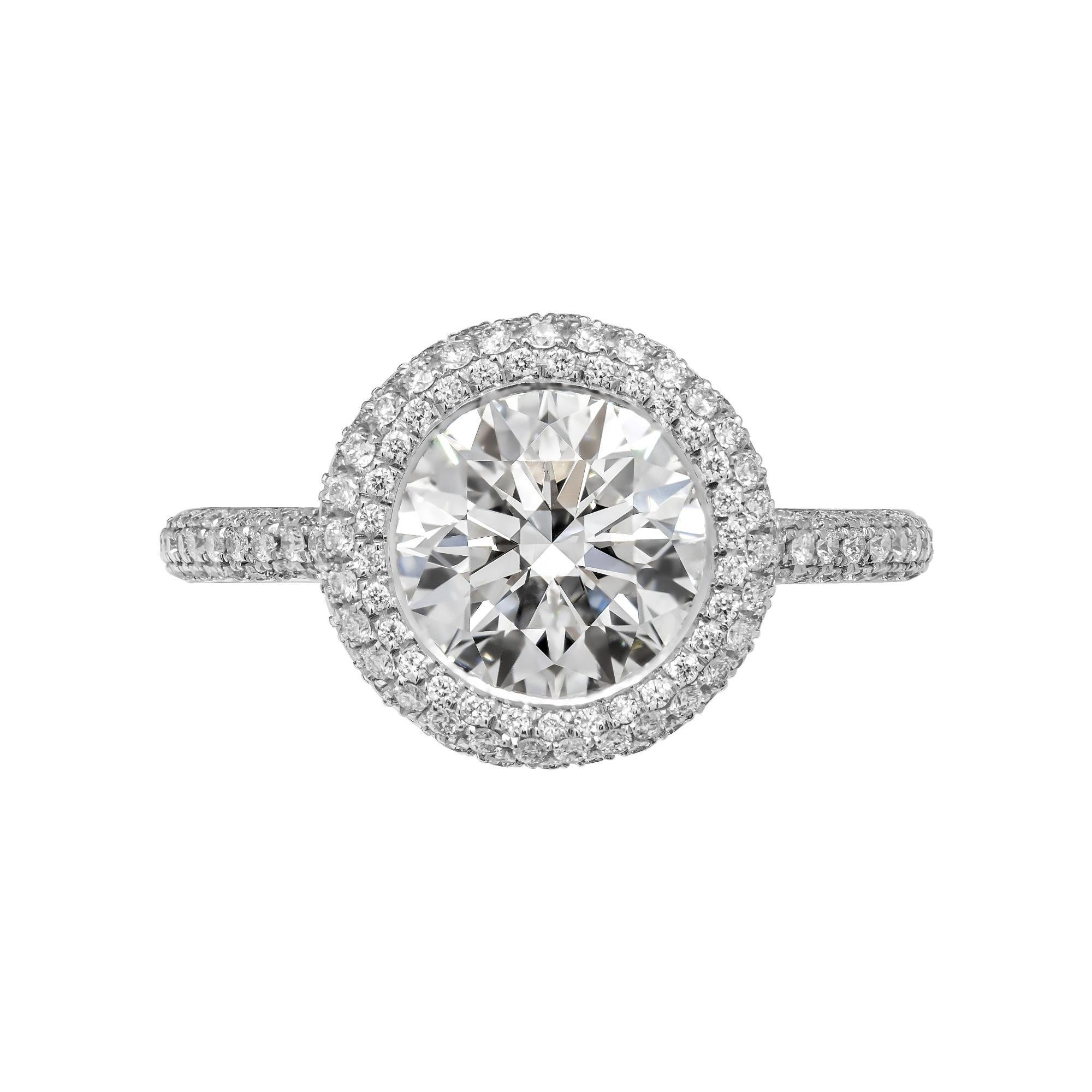 Timeless Classic Round Diamond Engagement - Timeless classis with a modern spin
Mounted in Platinum, featuring exceptional pave work that compliments the center stone,
Mounting features 3 row rounded halo around center & 3 row of round brilliant cut