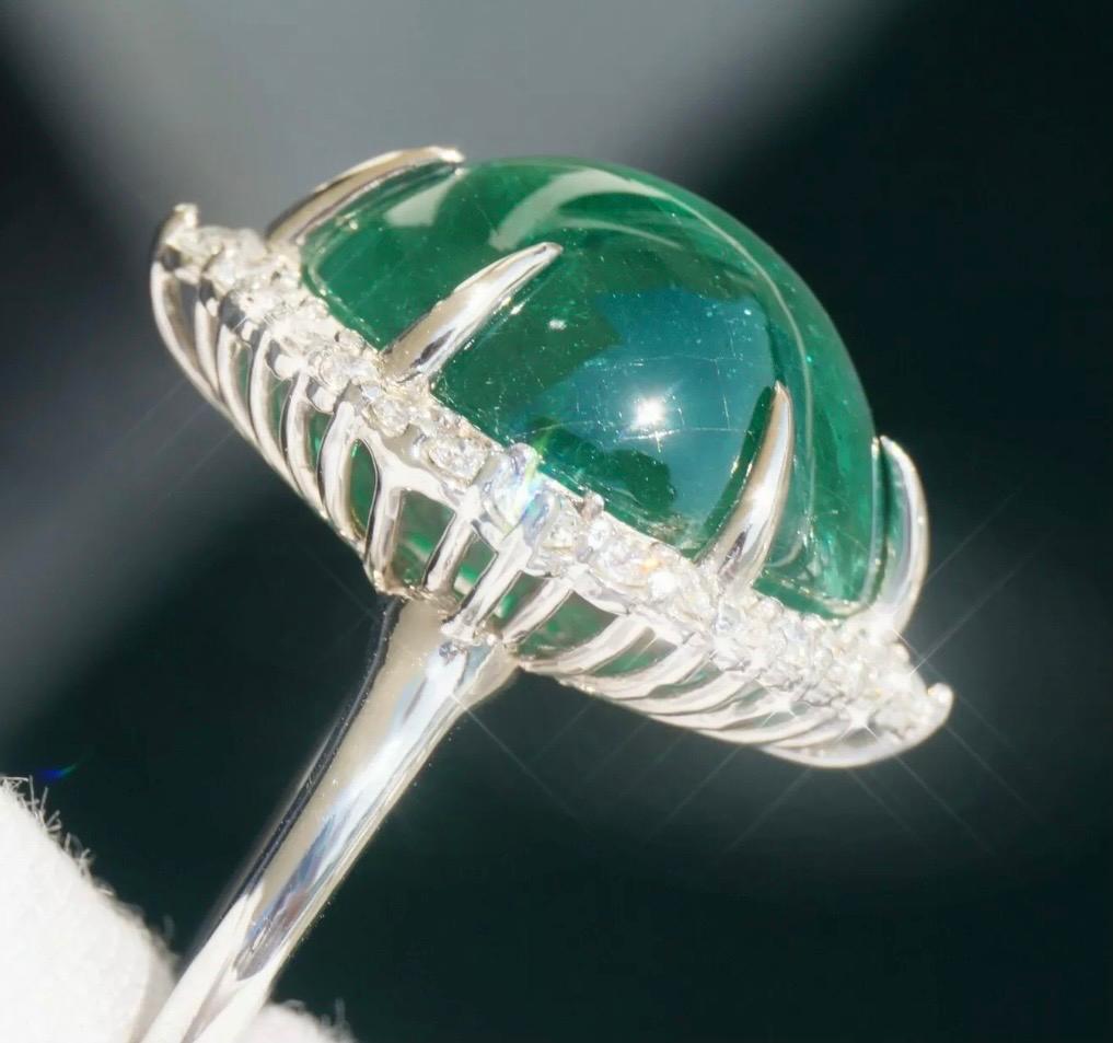 100% Natural, Earth Mined Emerald And Diamonds Ring. 20.51 Total Carat Weight & Certified by G.I.A!

The truly spectacular specimen is an earthshaking, massive 19.54 carat, beyond rare Natural Emerald. This amazing ring is a discerning collector's