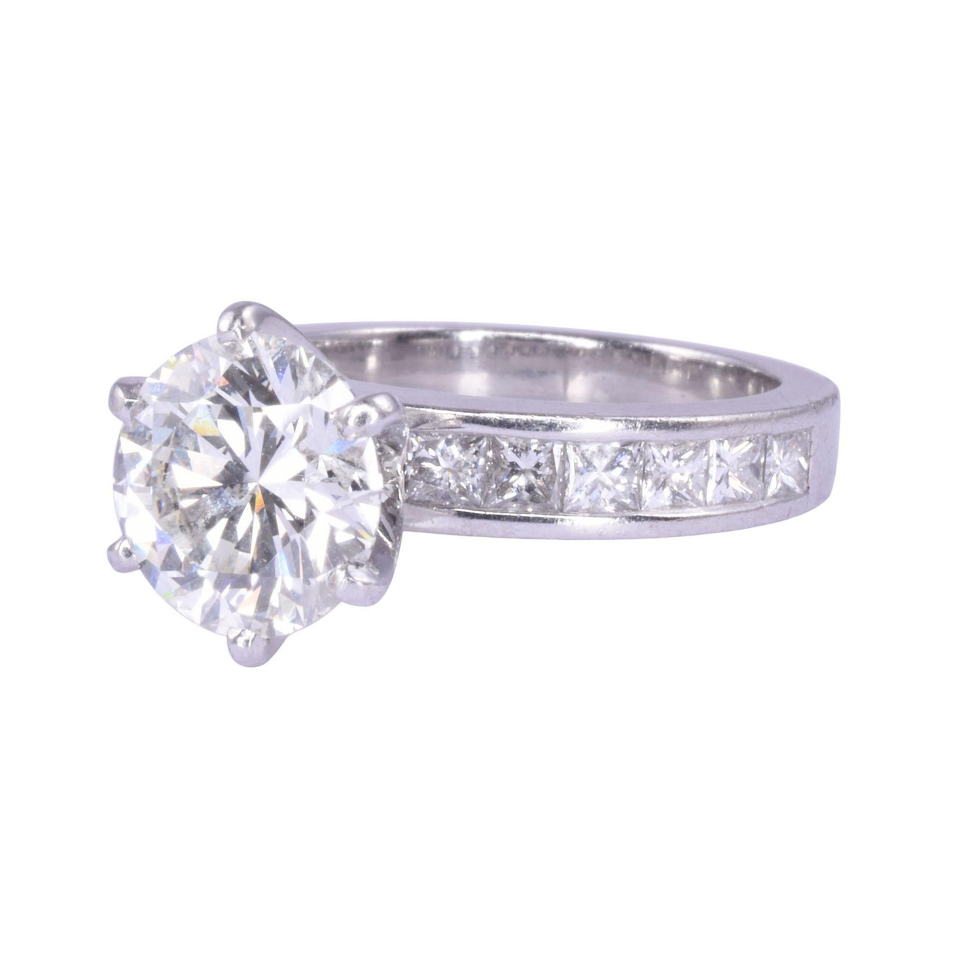 Estate GIA certified 2.06 carat diamond center engagement ring. This platinum engagement rings boasts a 2.06 carat center diamond GIA certified and laser inscribed 1106904878. The diamond has VS1 clarity and K color with no fluorescence. There are