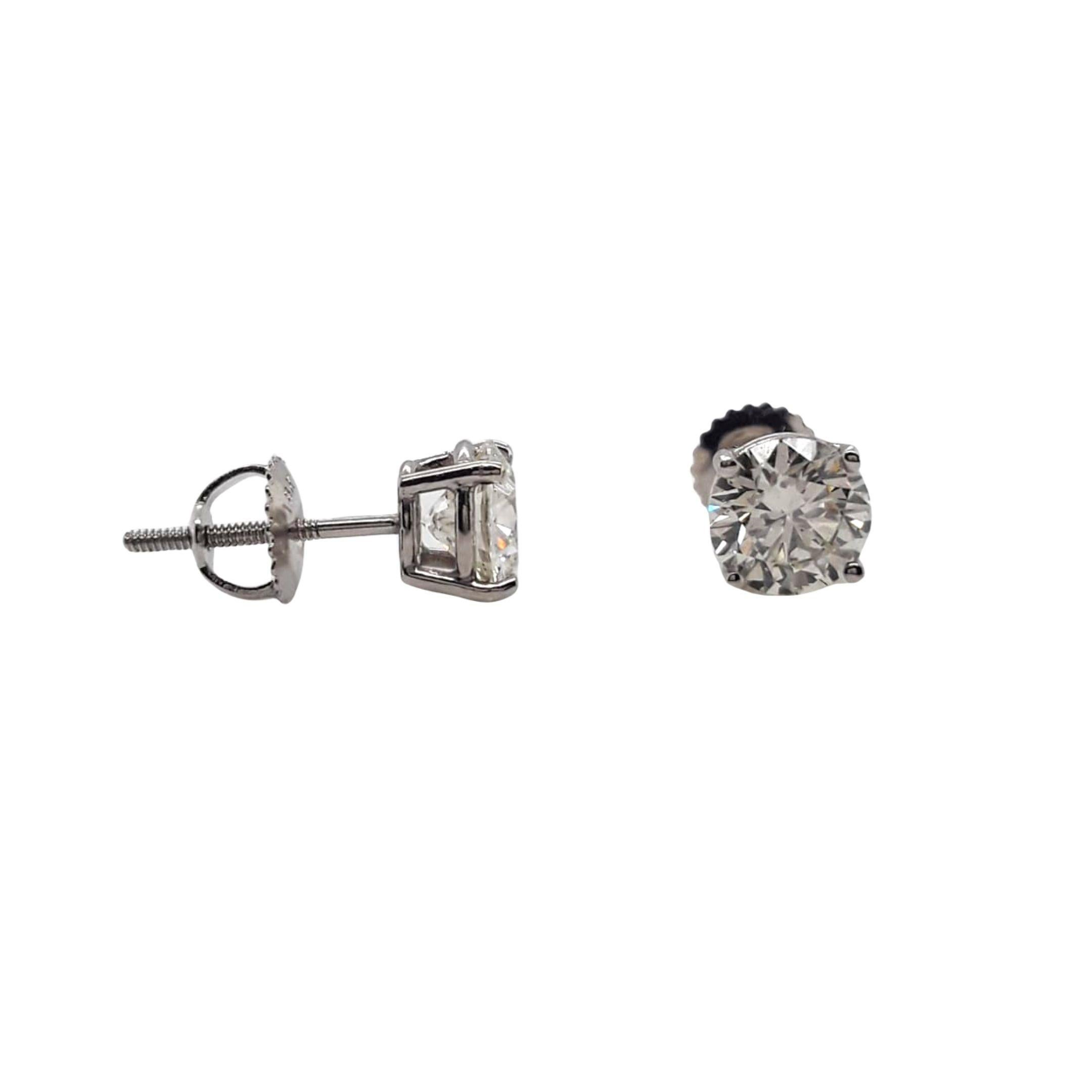 GIA Certified Diamond Stud Earrings made with natural brilliant cut diamonds. Total Weight: 2.06 carats, Stone Diameter: 6.47 x 6.59, Color: J, Clarity: SI2. Set on a 4 prong mounting in 18 karat white gold, screw back setting. 