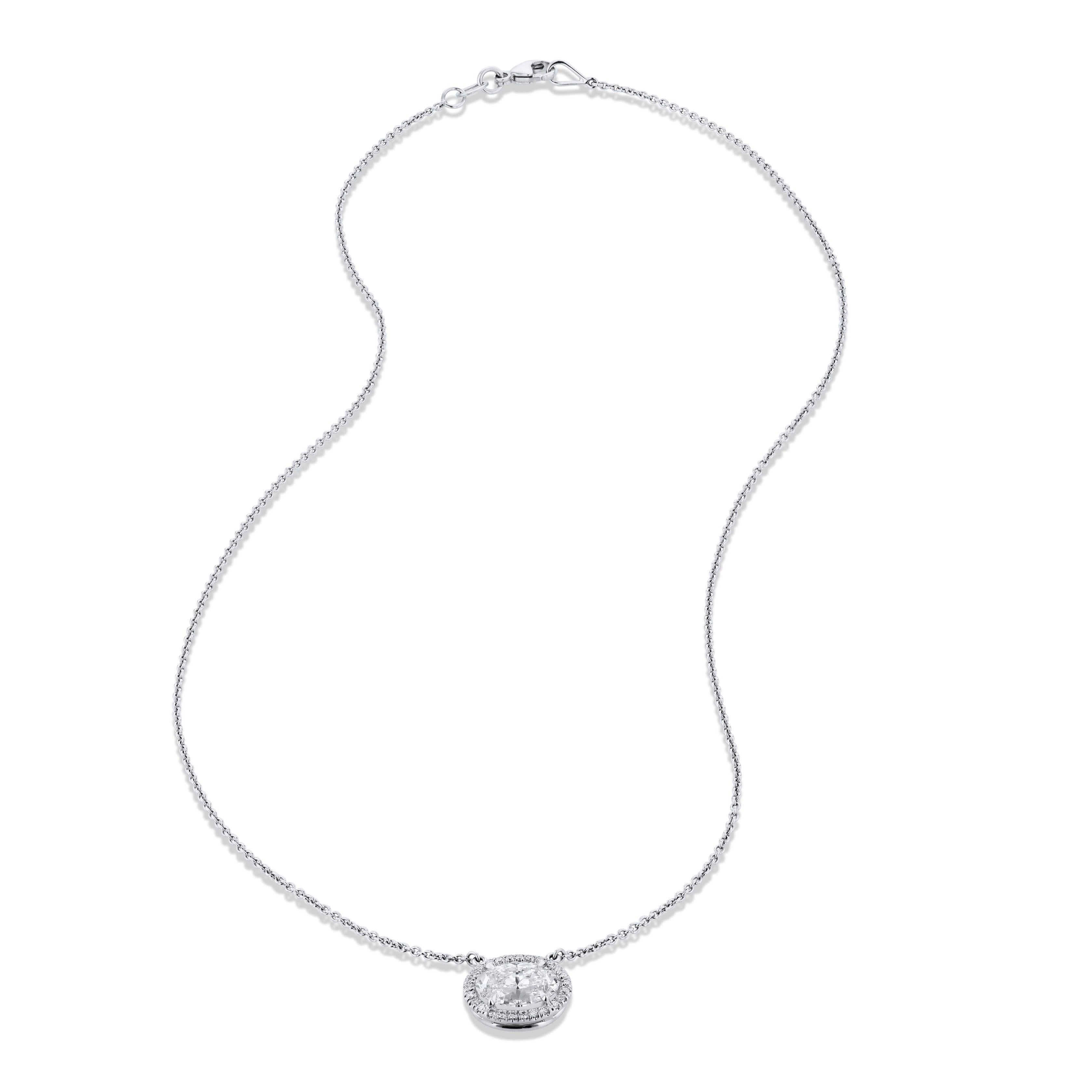 
This elegant White Gold Oval Diamond Pendant Necklace showcases a stunning 2.06 carat oval diamond.  It is I in color and VS2 in clarity. 
There are an additional 26 round pave-set diamonds totaling 0.14 G/H VS/SI1 surround the centerpiece in