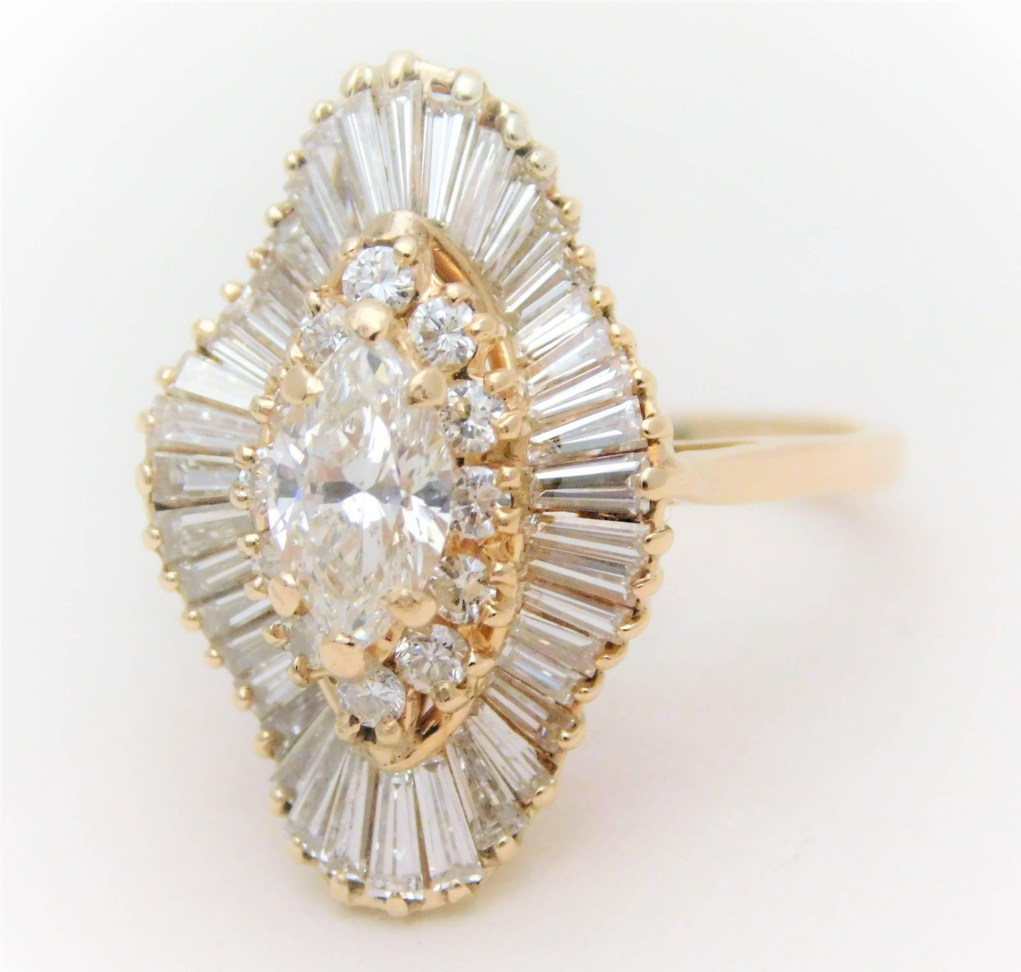 From an elegant New Orleans estate. This dazzling ring is made of solid 14k yellow gold. The style of this unique cluster-style ring is called ballerina due to all of its tapered baguettes flowing like a ballerina’s skirt. The style represents a