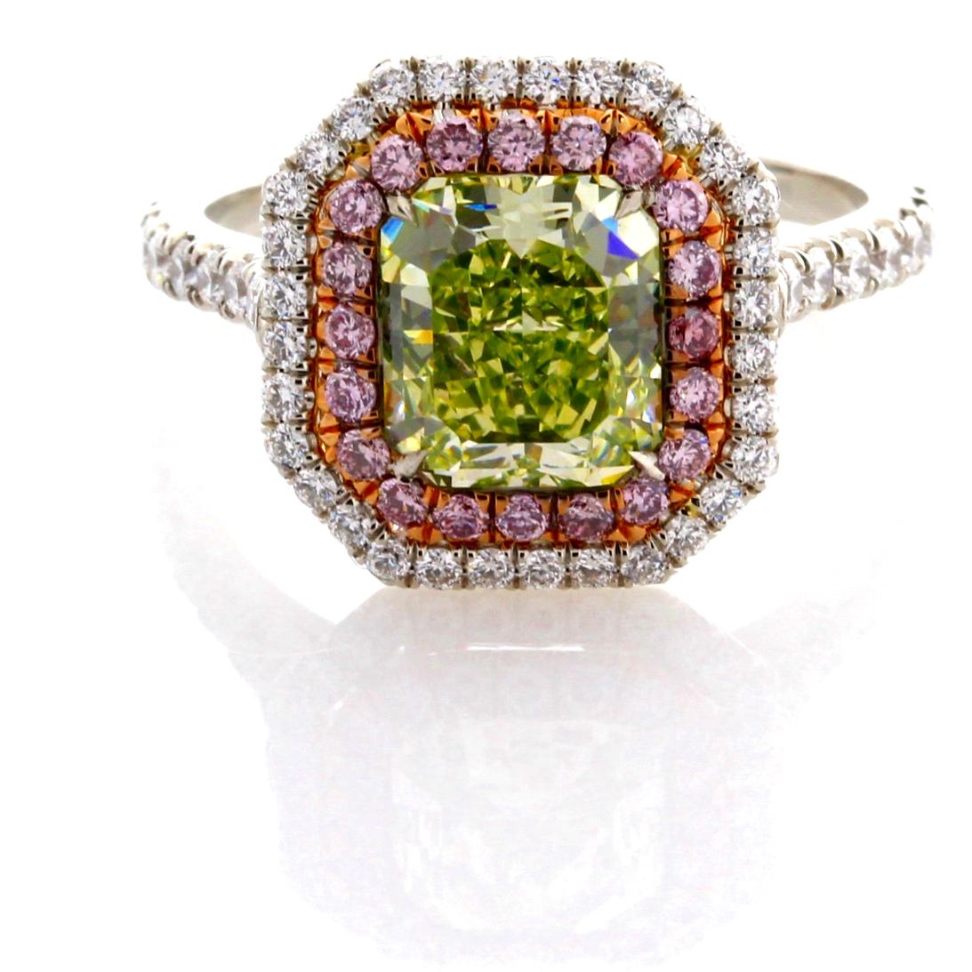 Incredible Deal on GIA Certified 2.07 Carat Radiant Cut, Natural Fancy Green-Yellow Even VS1 Clarity, Diamond Ring, measuring 7.64-6.74x4.42. Total Carat Weight on the ring is 2.87.
GIA CERTIFICATE #2185107705.  
This incredible setting was custom