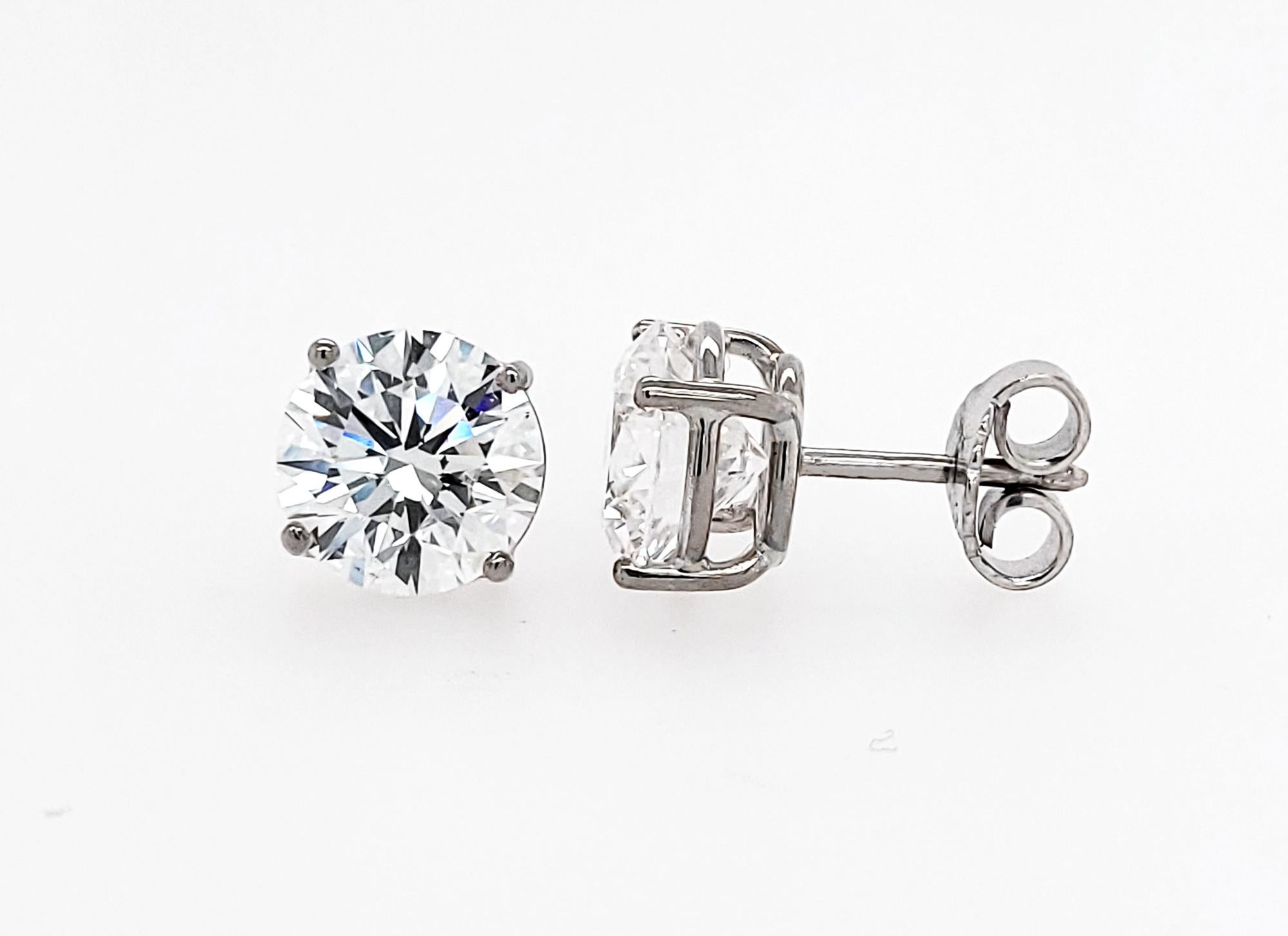 Beautiful stud earrings featuring 2.09 & 2.16 carat round diamonds.
The diamonds are GIA certified stating that they are of D color, VS2 clarity. 
Total carat weight is 4.25.
18k White Gold is 3.59 grams.
