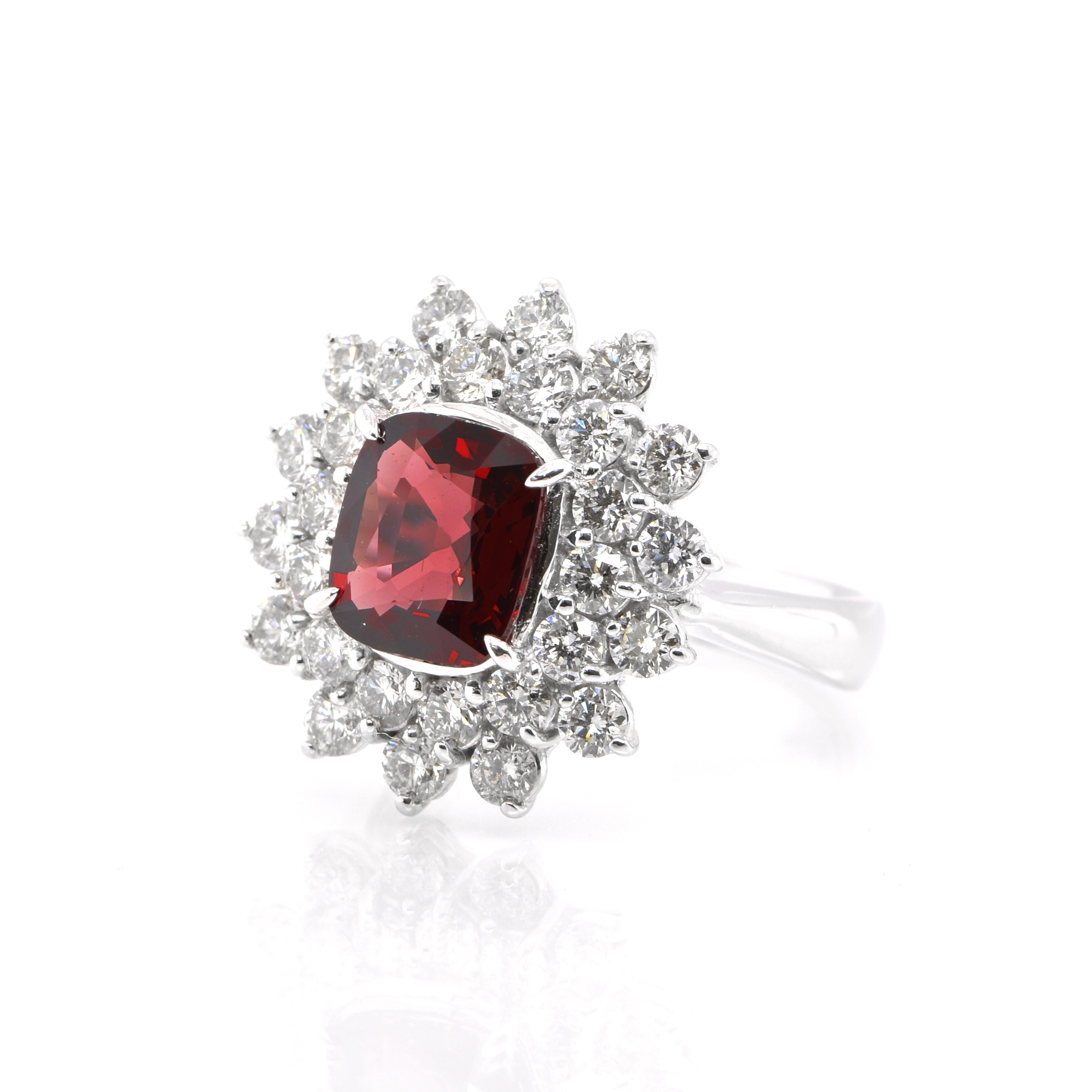 A beautiful cocktail ring consisting of a GIA certified 2.09 Carat Natural Untreated Red Spinel and 1.50 Carats of White Round Brilliant Diamond Accents set in Platinum. Spinel has been frequently confused with ruby, but it’s a gem that can stand on