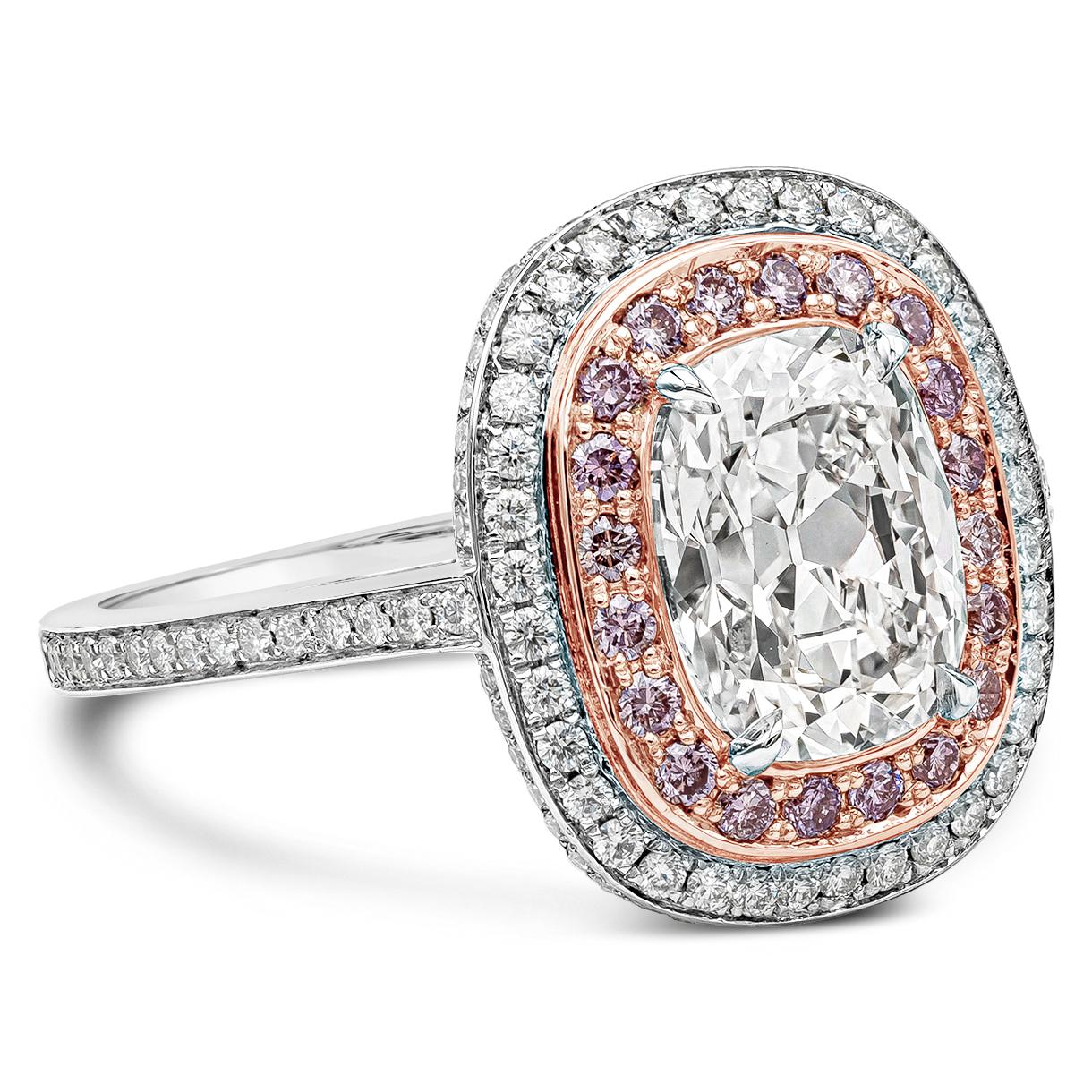 A well-crafted engagement ring style showcasing a 2.09 carats cushion cut diamond certified by GIA as E color and VVS2 in clarity. Surrounding the center diamond are round pink and white diamonds in a double halo setting. Shank is diamond encrusted