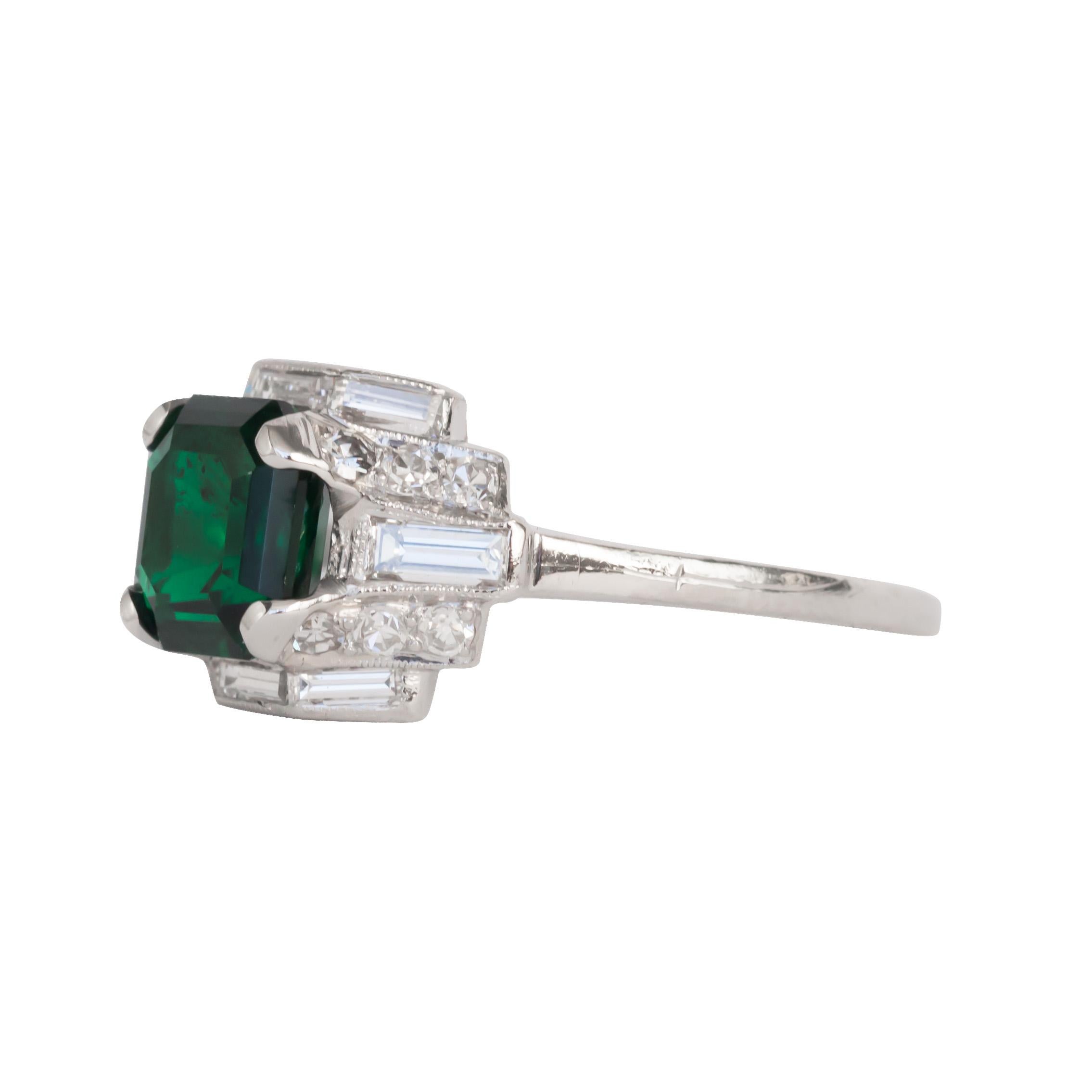 Item Details: 
Ring Size: 7
Metal Type: Platinum [Hallmarked, and Tested]
Weight: 4.7 grams

Center Diamond Details:
GIA REPORT # 6203449354
Weight: 2.10ct
Cut: Octagon Step Cut
Color: Green
Comments: NO OIL, NO TREATMENT

Side Diamond