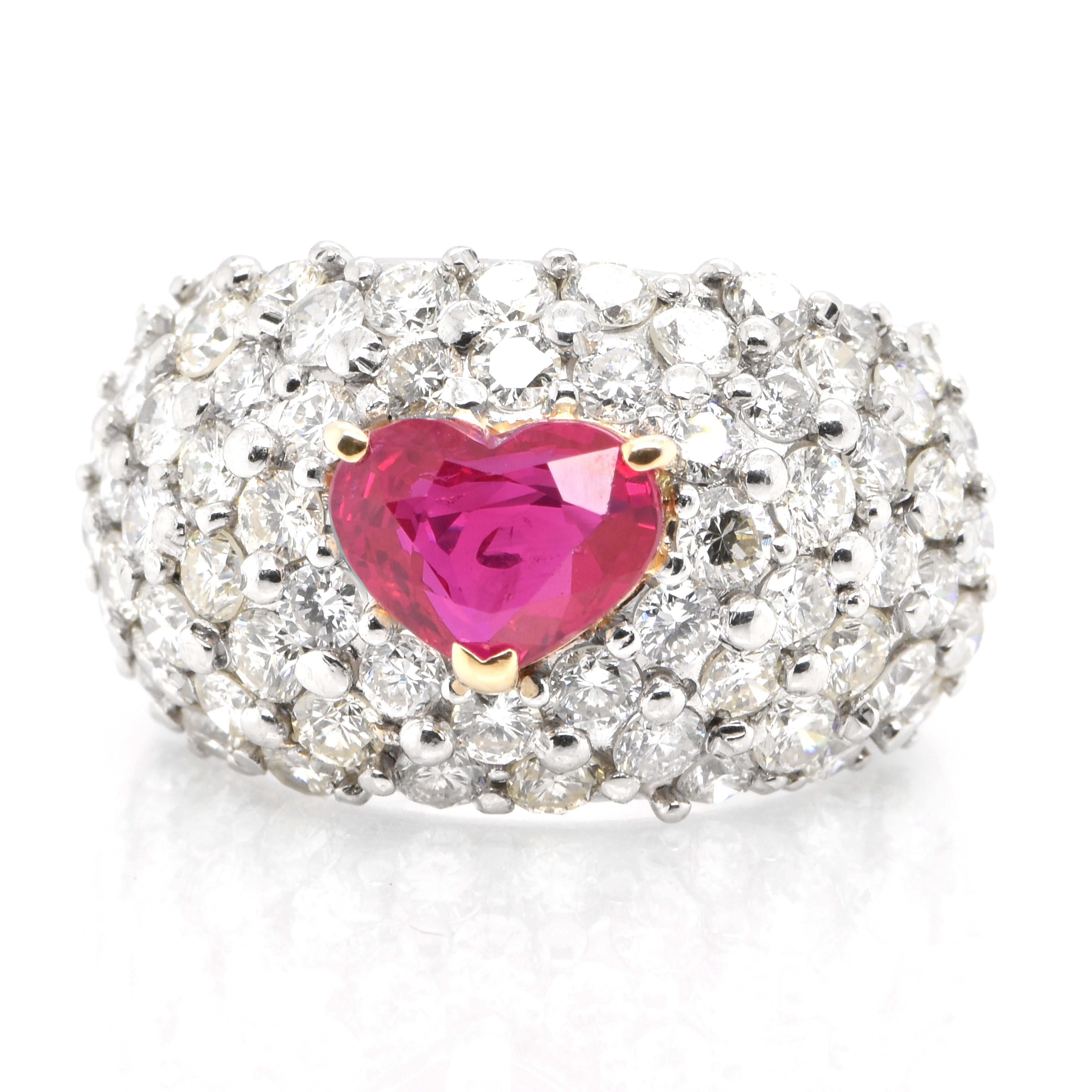 A beautiful ring set in Platinum and 18K Gold featuring a GIA Certified 2.106 Carat Natural Burmese Ruby and 3.682 Carat Diamonds. Rubies are referred to as 