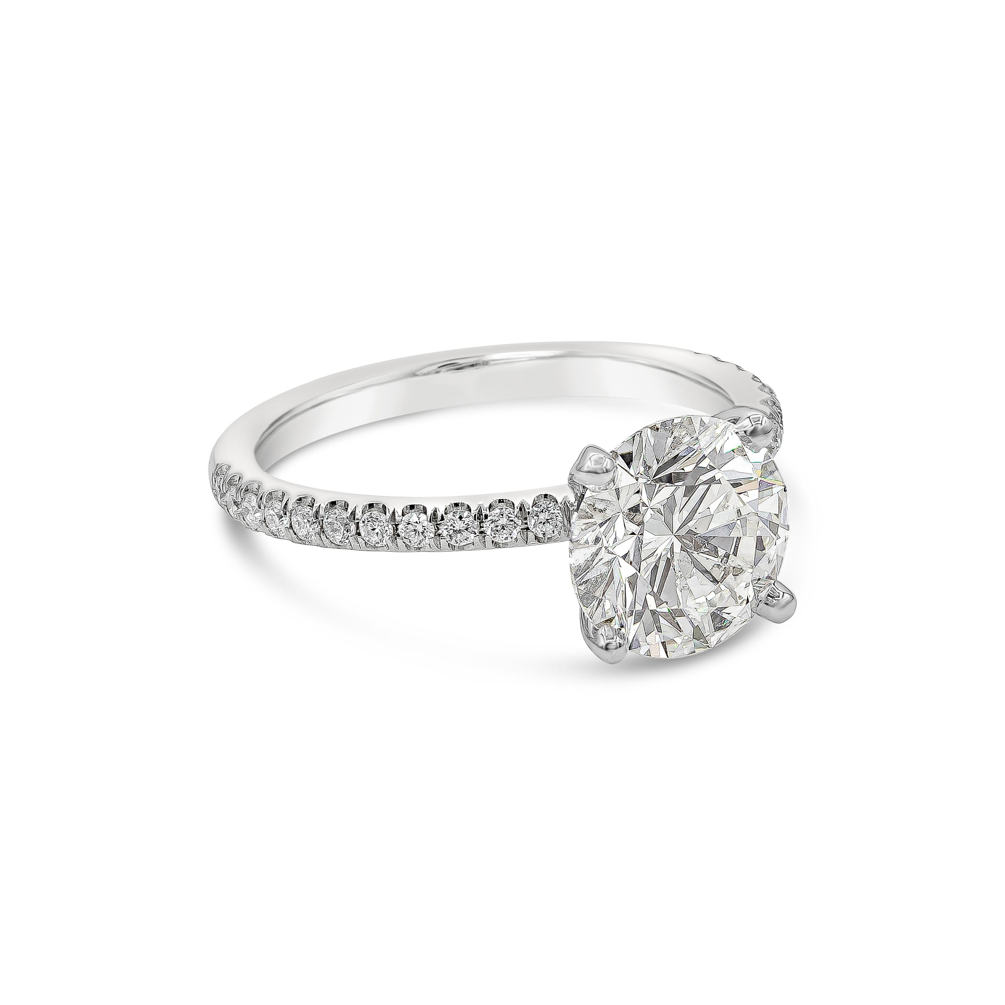A classic pave engagement ring style showcasing a 2.10 carat round brilliant diamond, certified by GIA as G color, SI2 clarity. Set in a diamond encrusted shank made in 18k white gold. Accent diamonds weigh 0.20 carats total.

Style available in