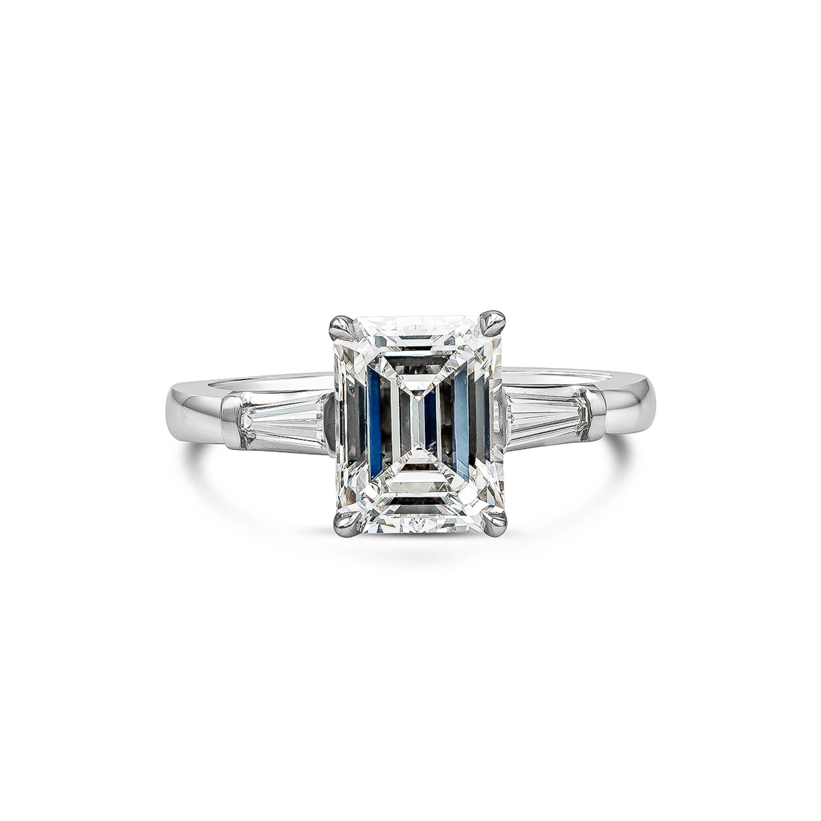 A timeless engagement ring showcasing 2.12 carat emerald cut diamond certified by GIA as G color, SI1 clarity. Flanking the center are tapered baguette diamonds weighing 0.25 carats. Made in platinum. Size 5.75 US (sizable upon request).

Style