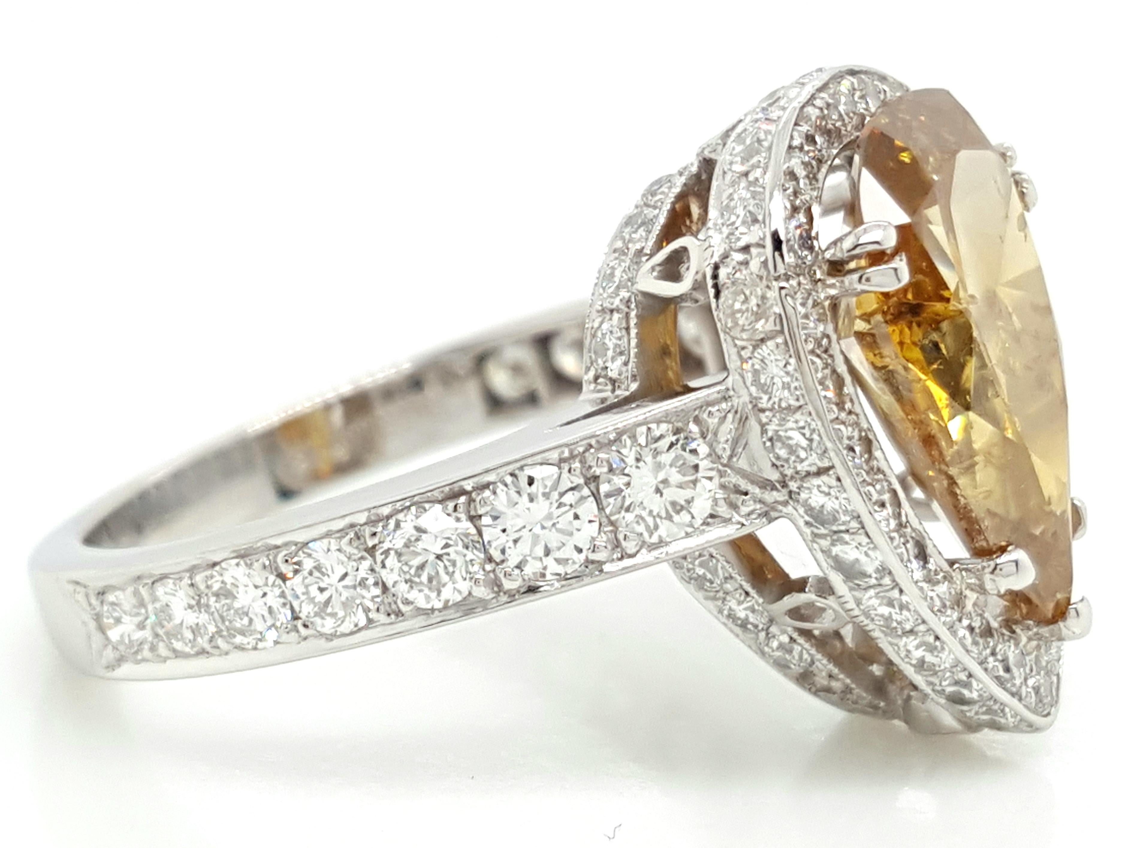 Contemporary GIA Certified 2.12 Carat Fancy Yellow Pear Diamond Ring