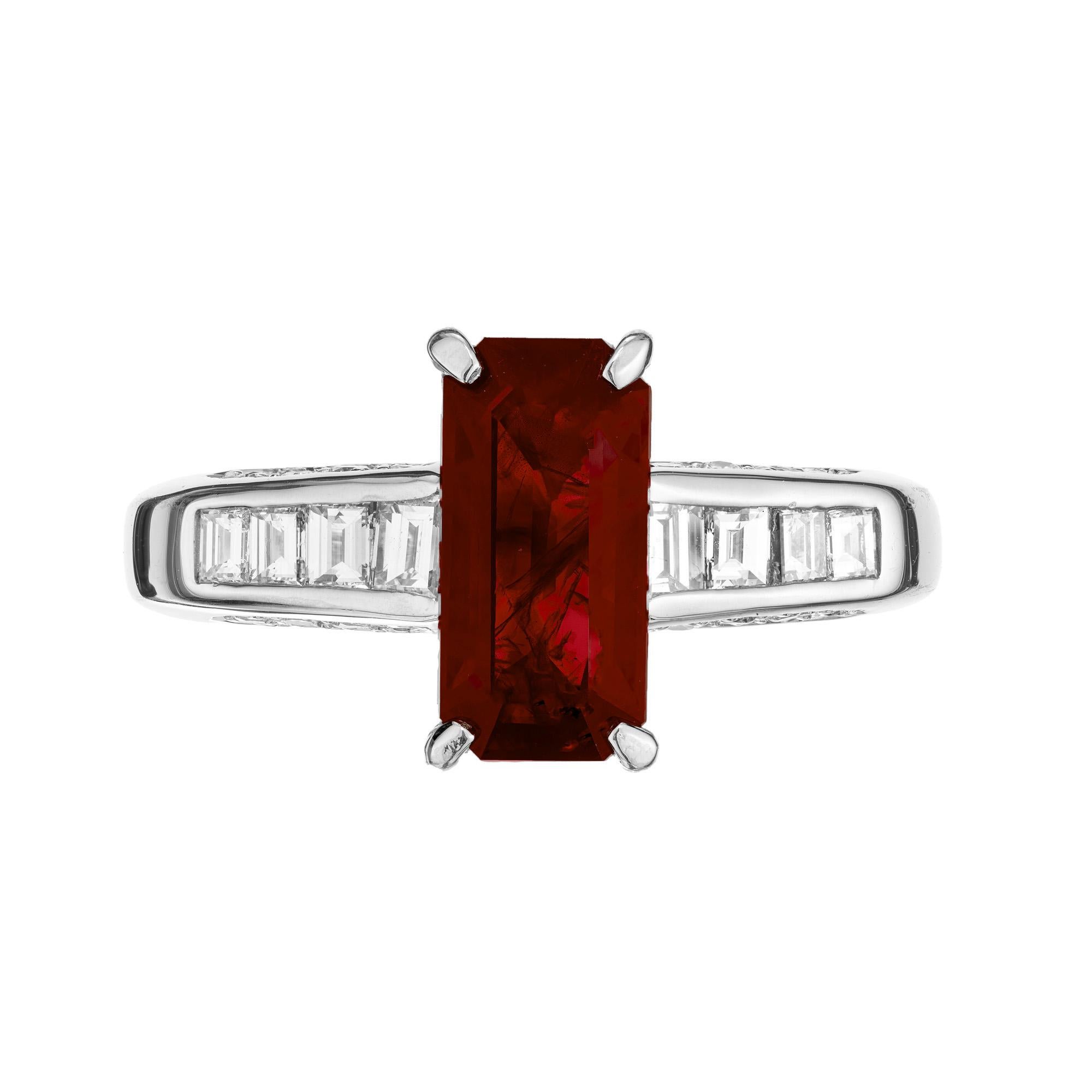 Rare and unusual elongated emerald cut natural Burma, Myanmar, ruby and diamond ring. The center piece of this ring is a 2.15ct octagonal ruby, which is mounted in a platinum setting. Accented with 8 square step cut diamonds and 16 round brilliant