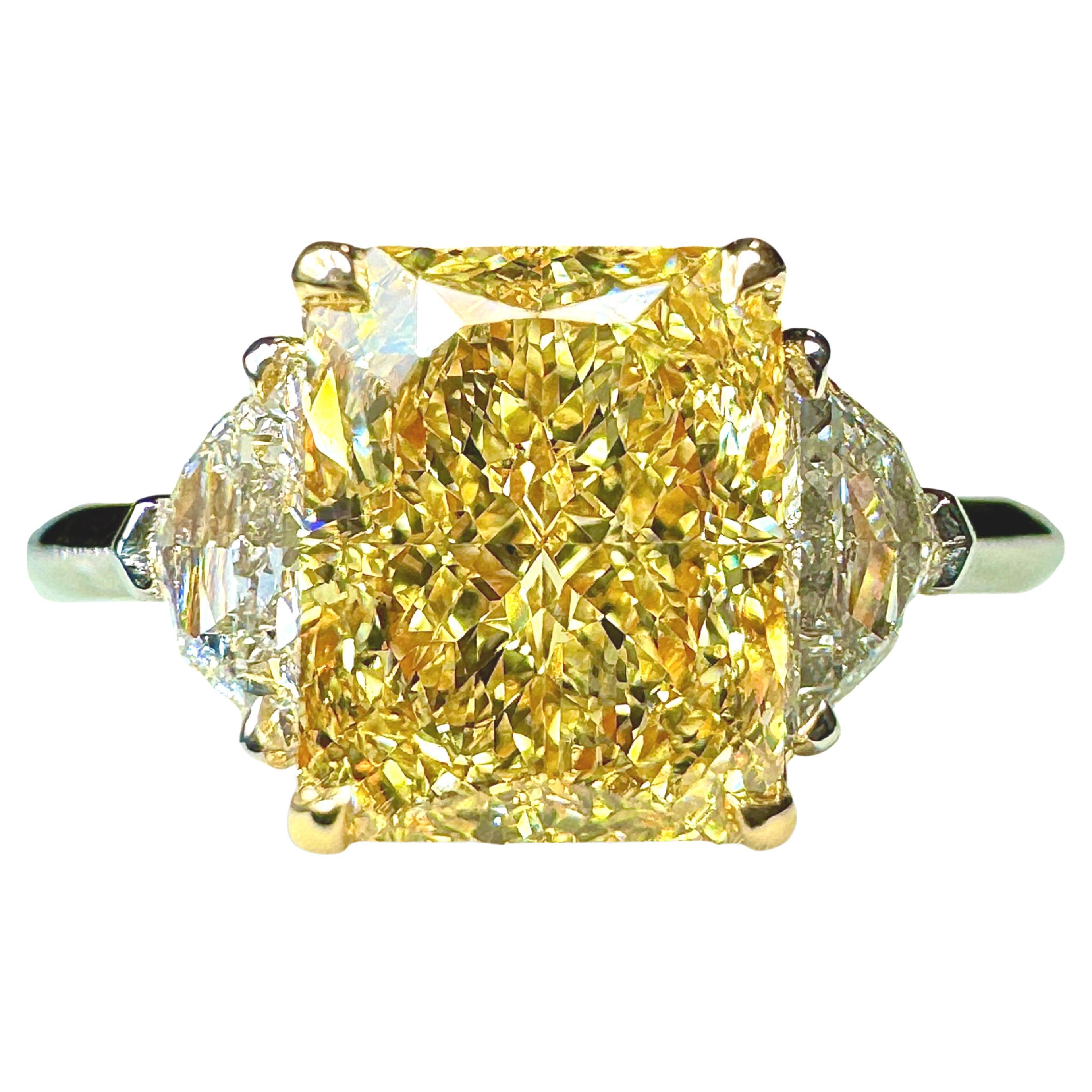 GIA Certified 2.16 Radiant Cut Fancy Yellow Diamond 3 Stone Ring For Sale