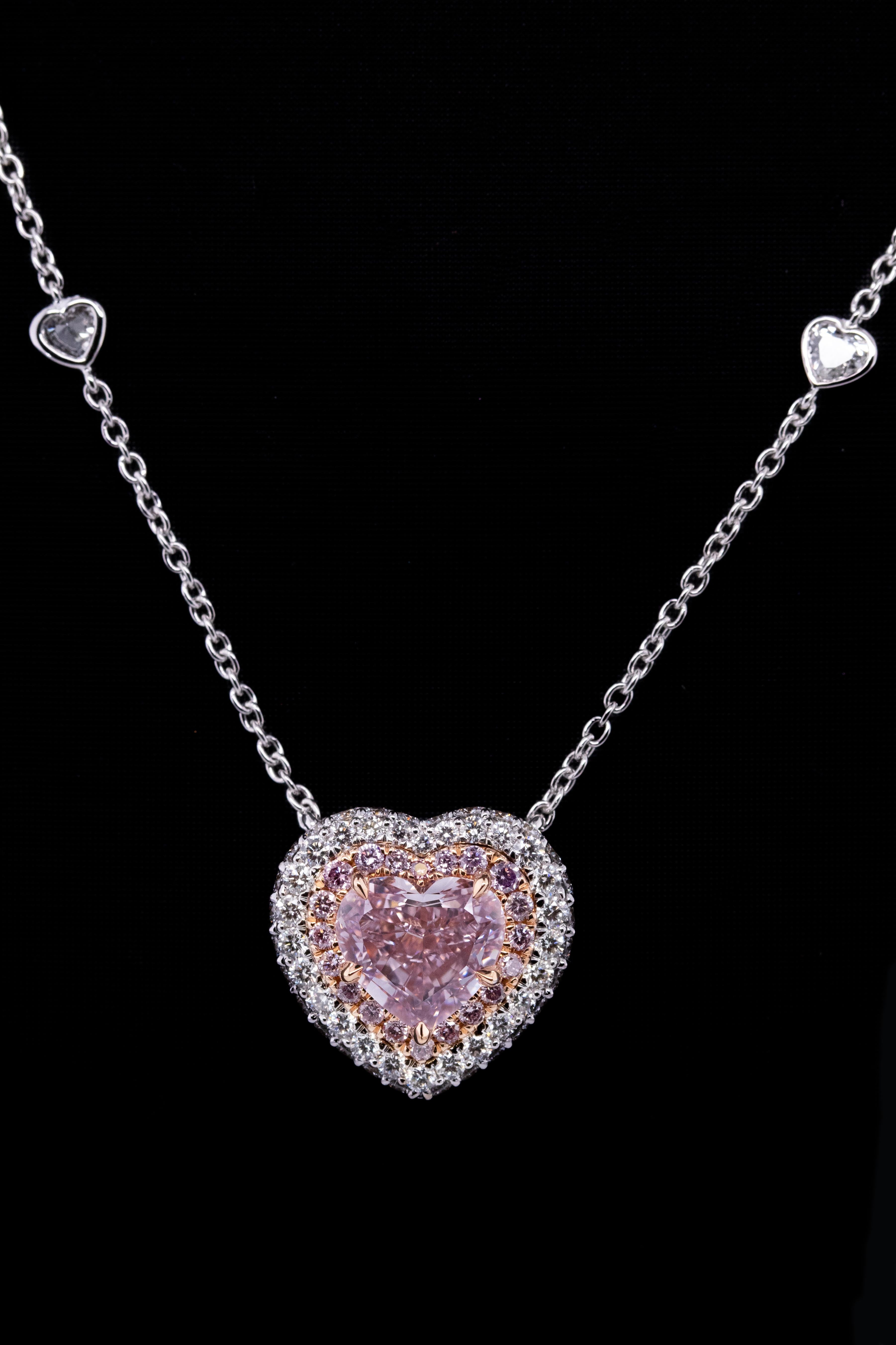 2.16ct Fancy Pink Heart Shape, VS2,

GIA#1206871401,

set in 18KWG with 4 psc HS = 0.47cttw

Plus Pink diamonds melee = 0.209cttw

Plus colorless melee = 0.911 cttw