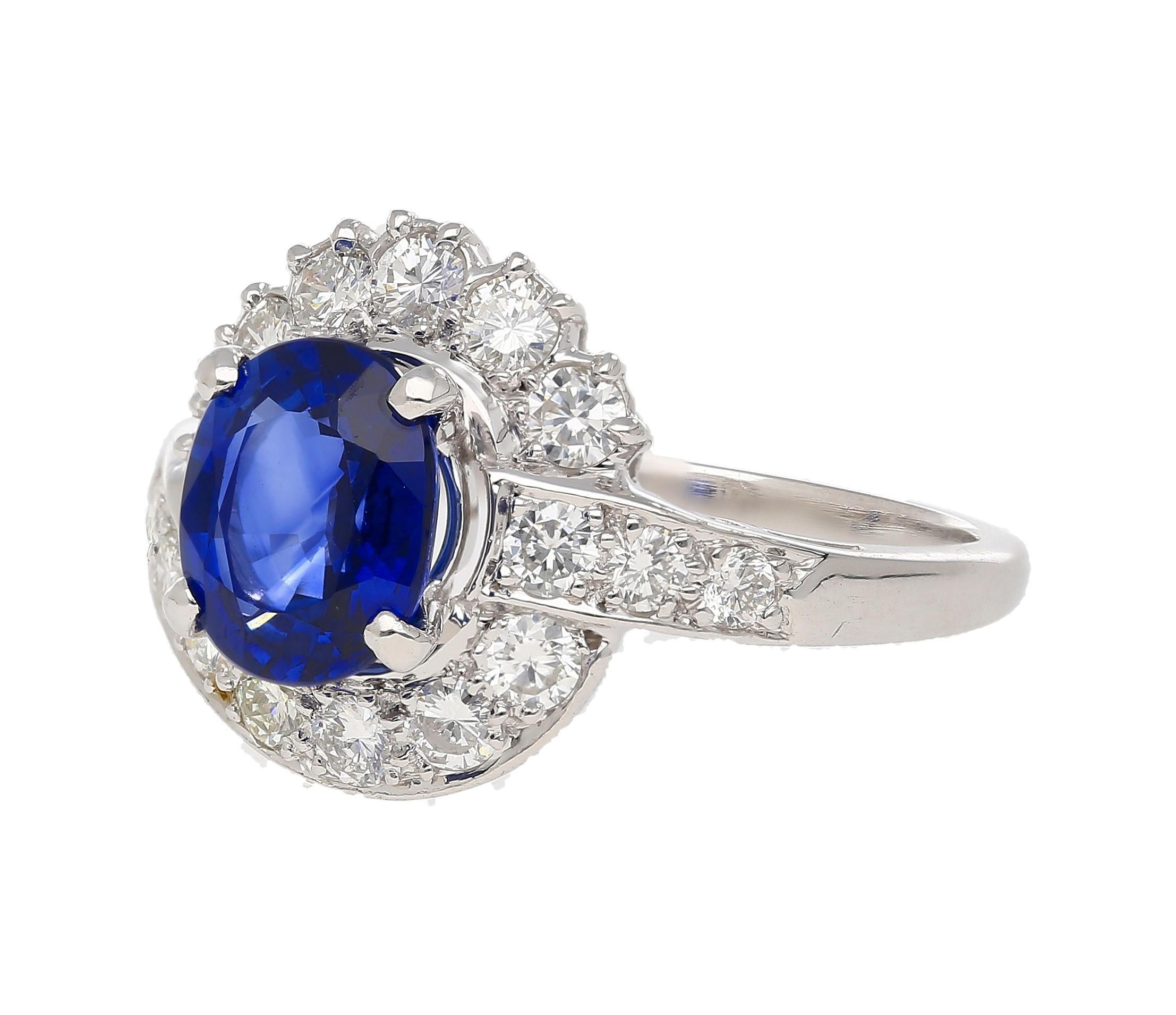Details:
Item Type: Bypass Ring
Metal: Platinum
Size: 7 (adjustable)
Weight: 6.02 Grams
Setting: 4-prong, Channel, Shared Prong
Band: Bypass Shank

Center Stone Details:
Stone Type: Natural Sapphire
Carat: 2.18 
Cut: Oval
Color: Blue
Setting: