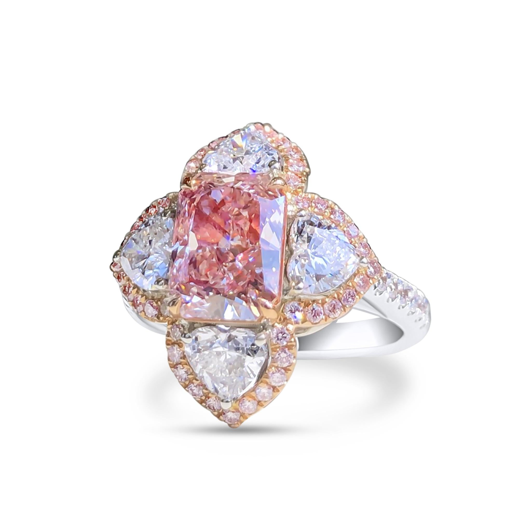 We invite you to discover this magnificent cocktail ring set with a GIA certified rectangular cut pink diamond of 2.18 carats enhanced with 4 heart cut colorless diamonds weighing approximately 0.30 carats each GIA certified.
The ideal ring to
