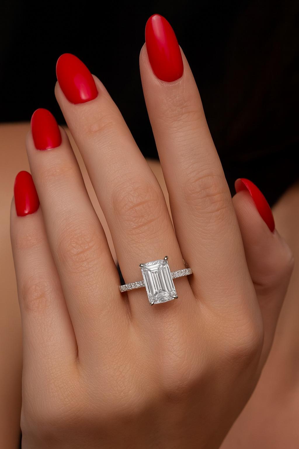 GIA Certified 2.20 Carat F VVS2 Emerald-Cut Diamond Pavé Platinum Ring

An elegant, elongated emerald-cut diamond—crisp step facets and a clean hall-of-mirrors glow—starring in a refined platinum pavé setting. The band is delicately micro-pavé set