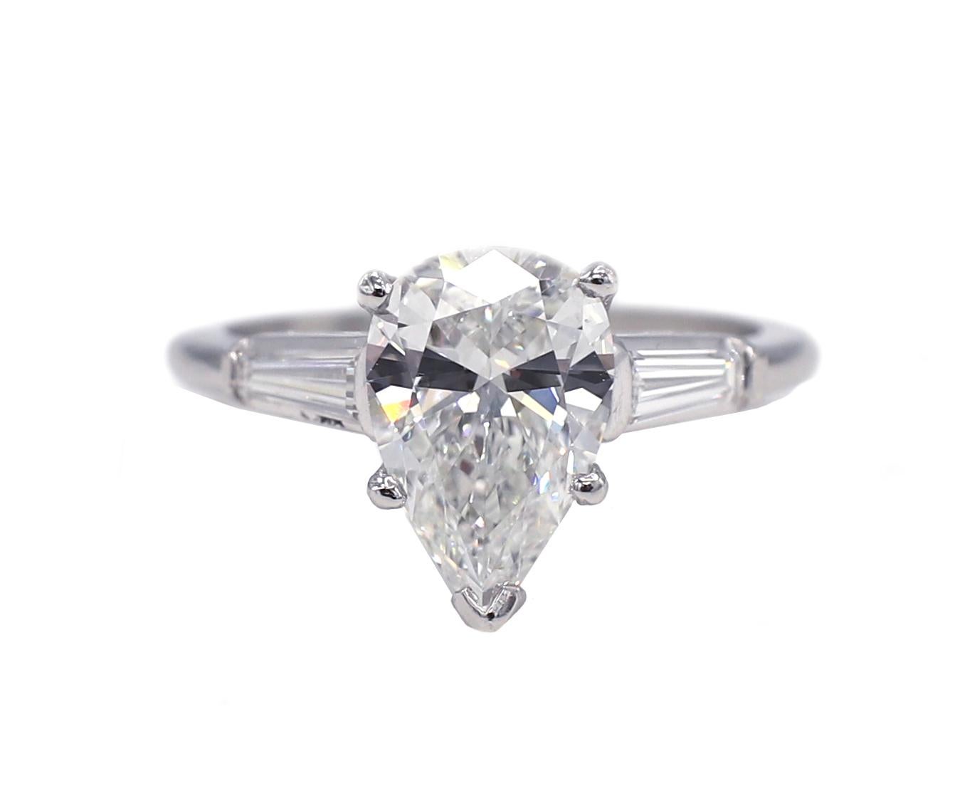 GIA Certified 2.20 Carat Pear Shape G SI1 Platinum Diamond Engagement Ring 
GIA report number: 6224336380
Diamond: 2.20 carat pear brilliant G SI1 
Accent diamonds: 2 tapered baguette diamonds, approx. .25 CTW G VS
Metal: Platinum
Weight: 5.11