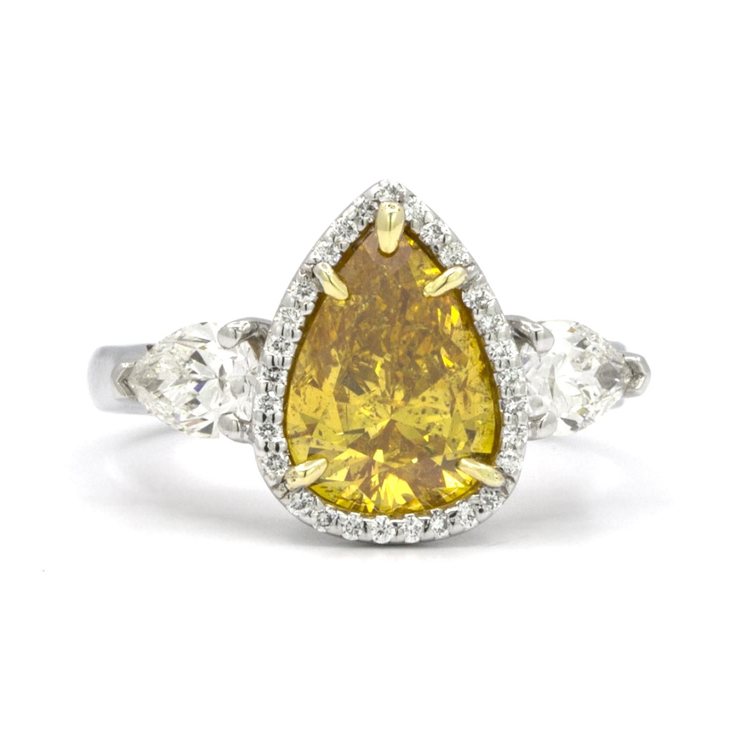 GIA Certified 2.20 Carat Pear Brilliant Vivid Yellow-Orange Diamond 3-Stone Ring In Good Condition For Sale In New York, NY