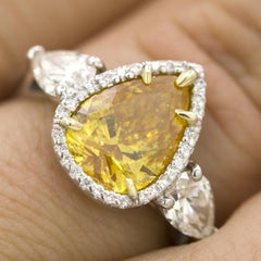 GIA Certified 2.20 Carat Vivid Yellow-Orange Pear Shape Diamond Ring
