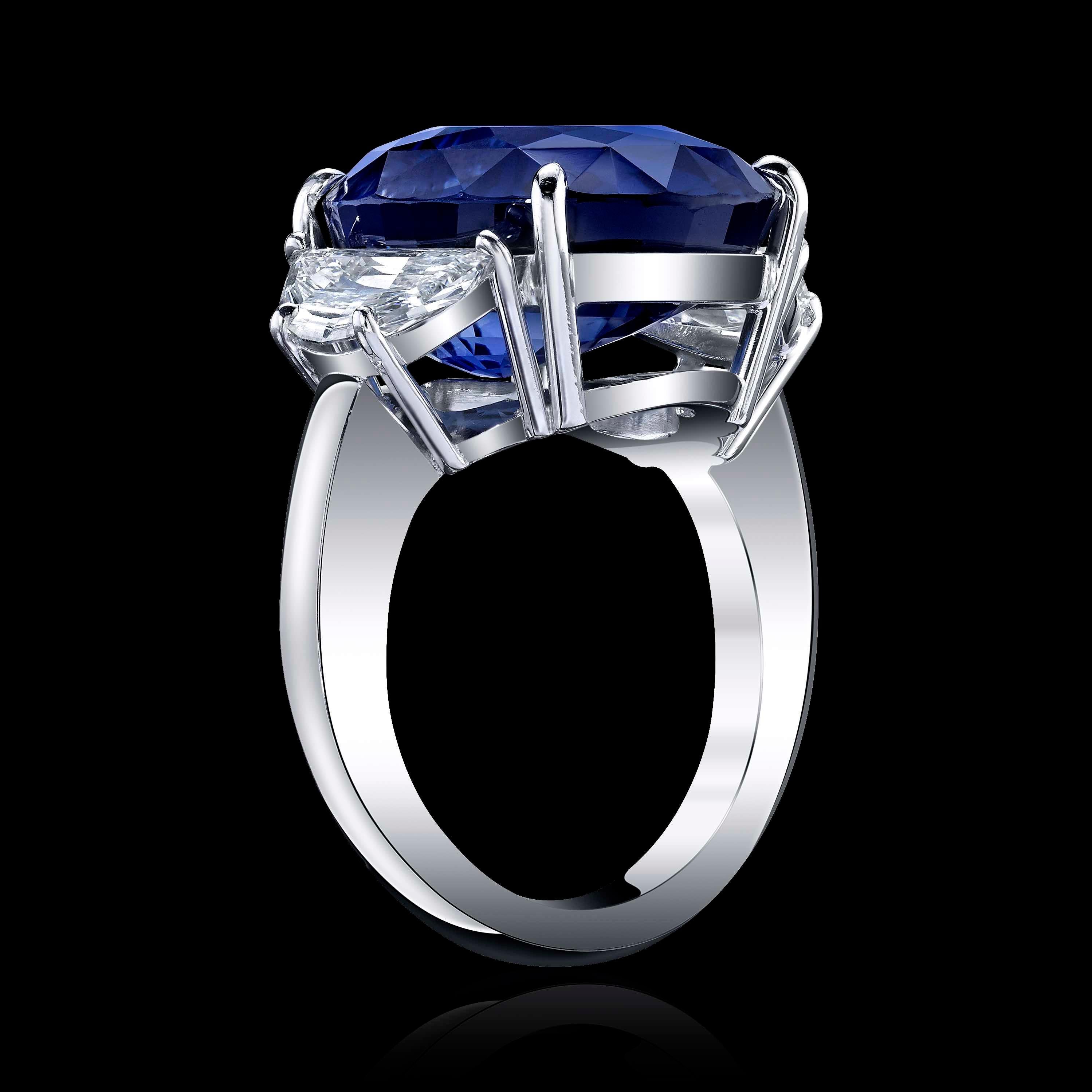 This 22.01ct Oval Blue Sapphire is an incredible stone, graded by both GIA GIA 61559544234 and AGL CS 35545 

This beauty is set in a platinum ring with two sides Half Moon Diamonds=with 0.50CTTW color - F/G and VS clarity 