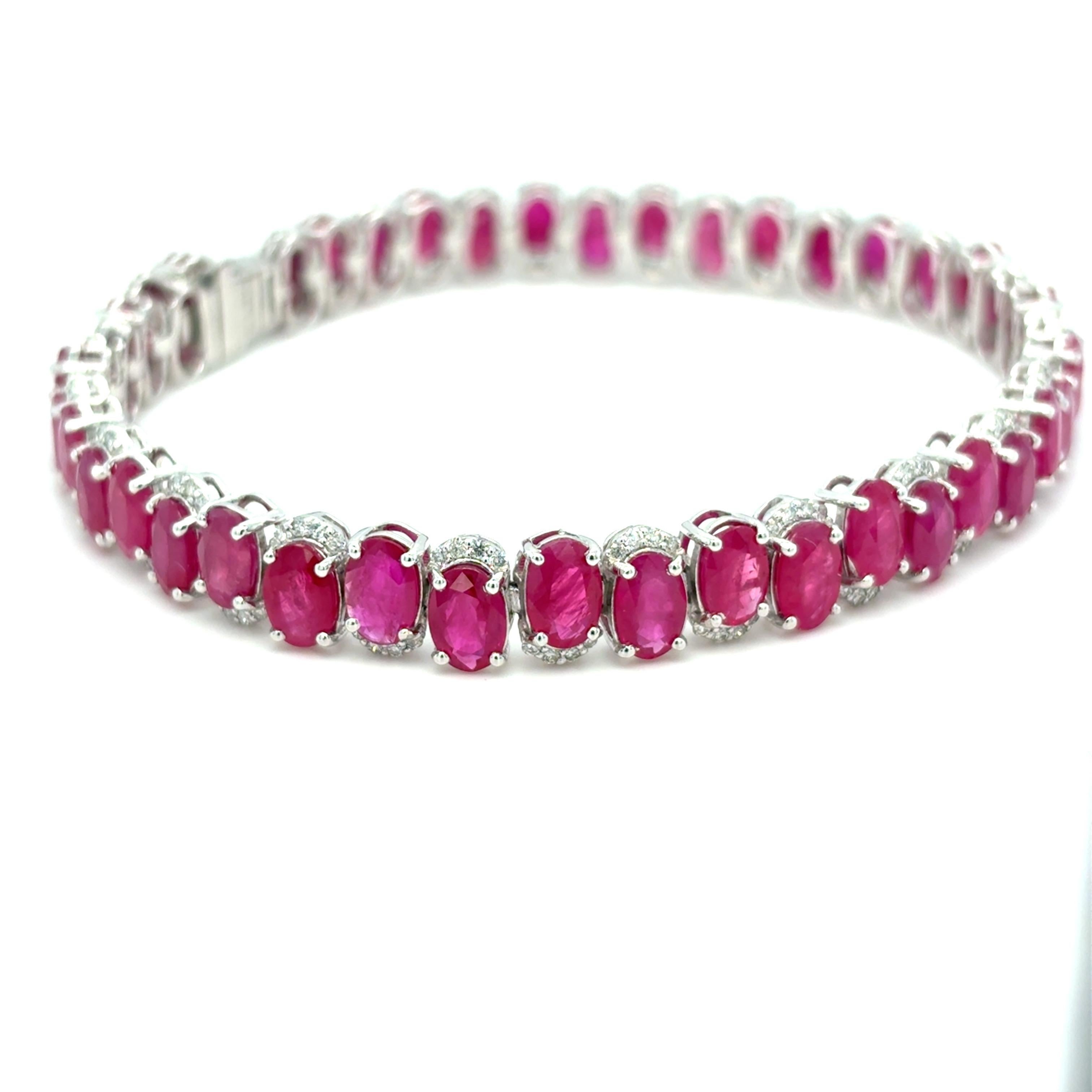 GIA-Certified 22.04-Carat Burmese Ruby & Diamond Bracelet
Crafted in platinum, this exquisite bracelet features 42 meticulously arranged Burmese rubies totaling 22.04 carats, complemented by 0.87 carats of accent diamonds. The 7-inch design combines