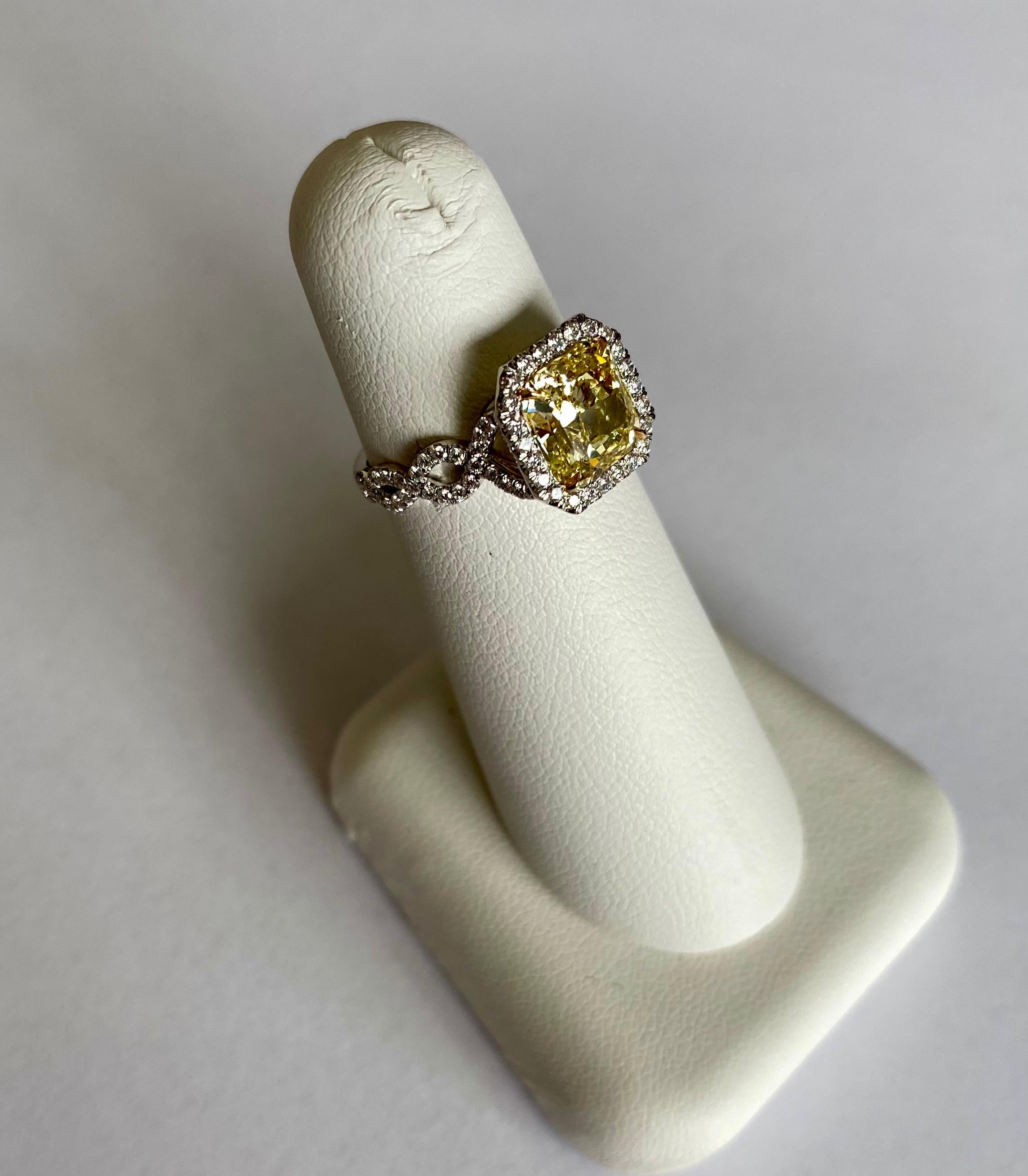 Modern GIA Certified 2.23 Carats Fancy Intense Yellow Diamond Ring For Sale