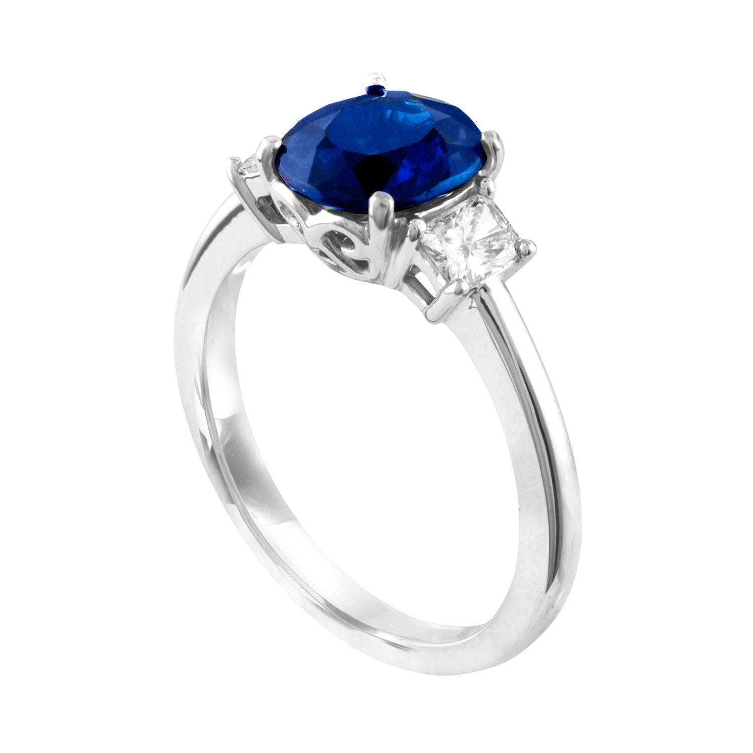 Stunning Three Stone Sapphire and Diamond Ring
The ring is 18K White Gold
The Cushion Blue Sapphire is 2.24 Carats Heated from Australia
The sapphire is GIA certified.
There are 2 Radiant Cut Diamonds 0.41 Carats F VS
The ring is a size 6.75,