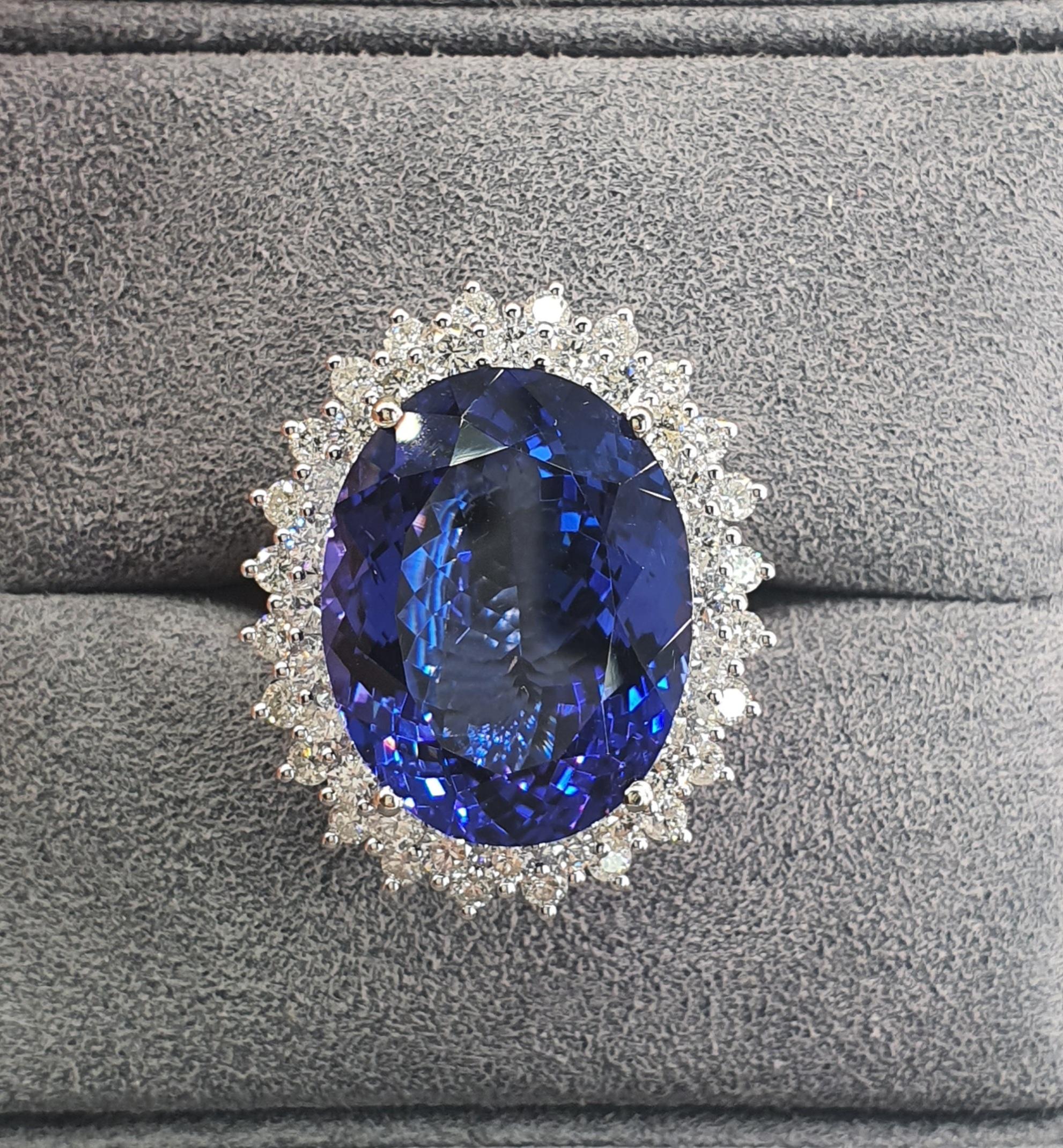 White Gold Ladies Ring with a bright polish finish. 
Condition is new.
 Containing: One prong set oval modified brilliant cut natural tanzanite, measuring 20.56 x 15.94 x 9.35mm, exact weight 22.43ct., clarity is eye clean, type I, medium,