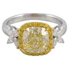 GIA Certified 2.26 Carat Cushion Cut Fancy Light Yellow Diamond Halo Ring