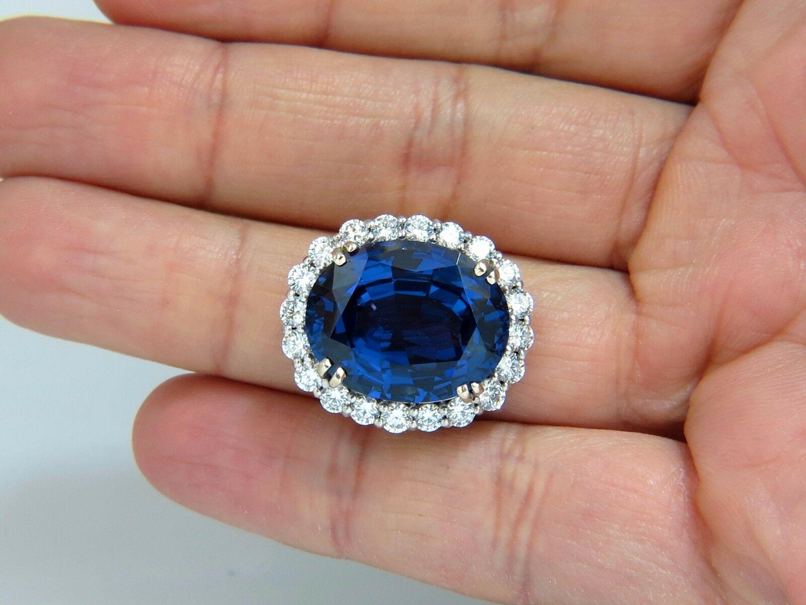 GIA Certified 22.61 Carat Natural Blue Tanzanite Diamonds Ring 18kt Halo Royale In New Condition For Sale In New York, NY