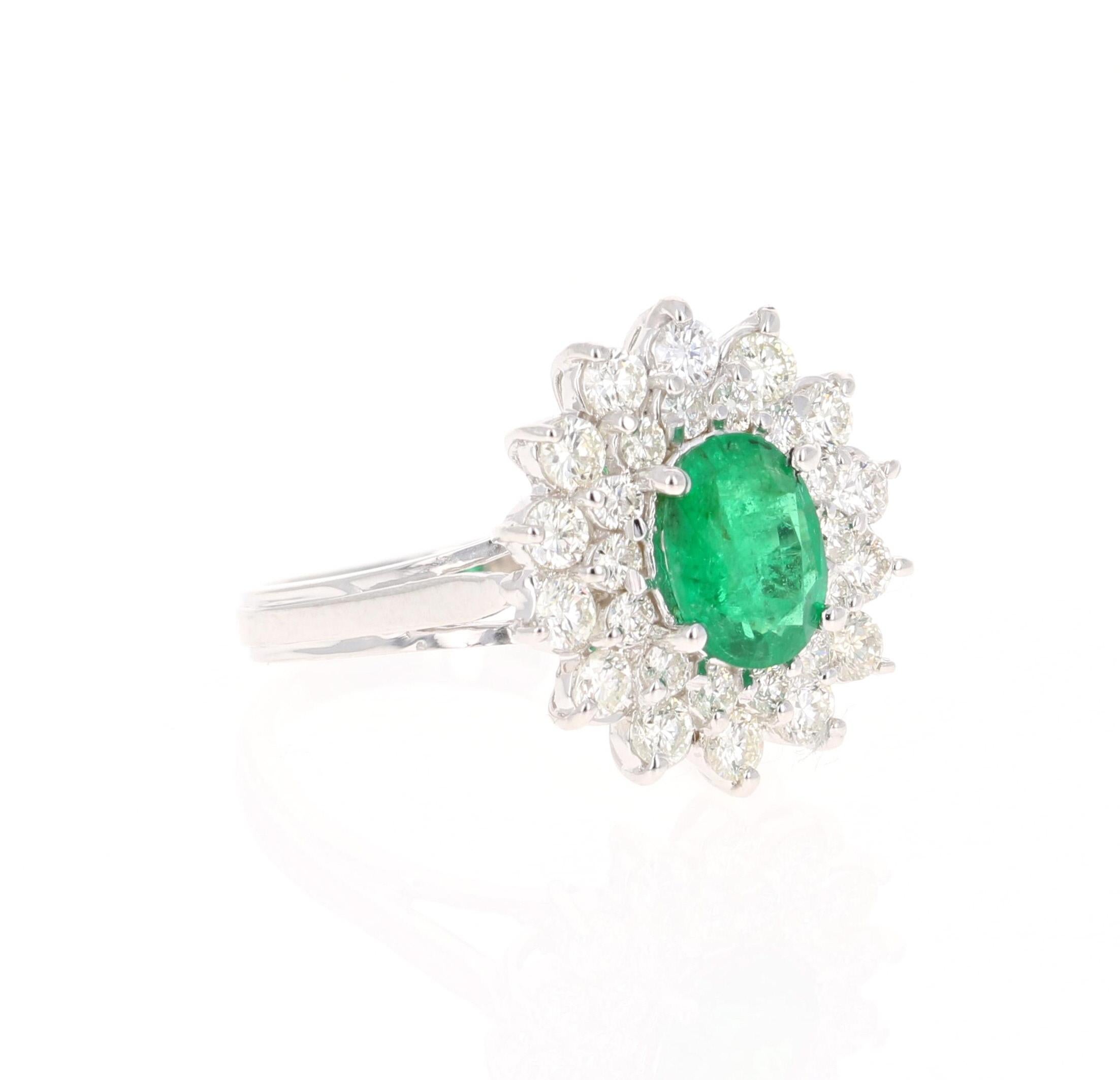 A beautiful 2.29 Carat Emerald and Diamond Ring in 18K White Gold.
This gorgeous ring has a 1.14 Carat Oval Cut Emerald that is set in the center of the ring!  The Emerald is surrounded by 28 Round Cut Diamonds that weigh 1.15 carats. The Clarity is
