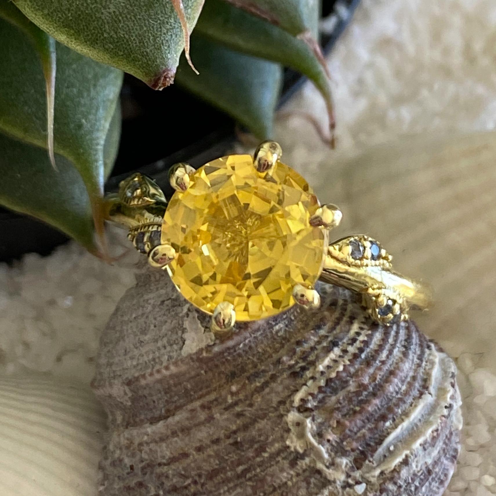 This new ring by Eytan Brandes is a design he made for one of our long-time customers in platinum with diamonds as an engagement ring.  He made an extra copy in 18 karat gold because he wanted a nice setting for a yellow sapphire he's had for