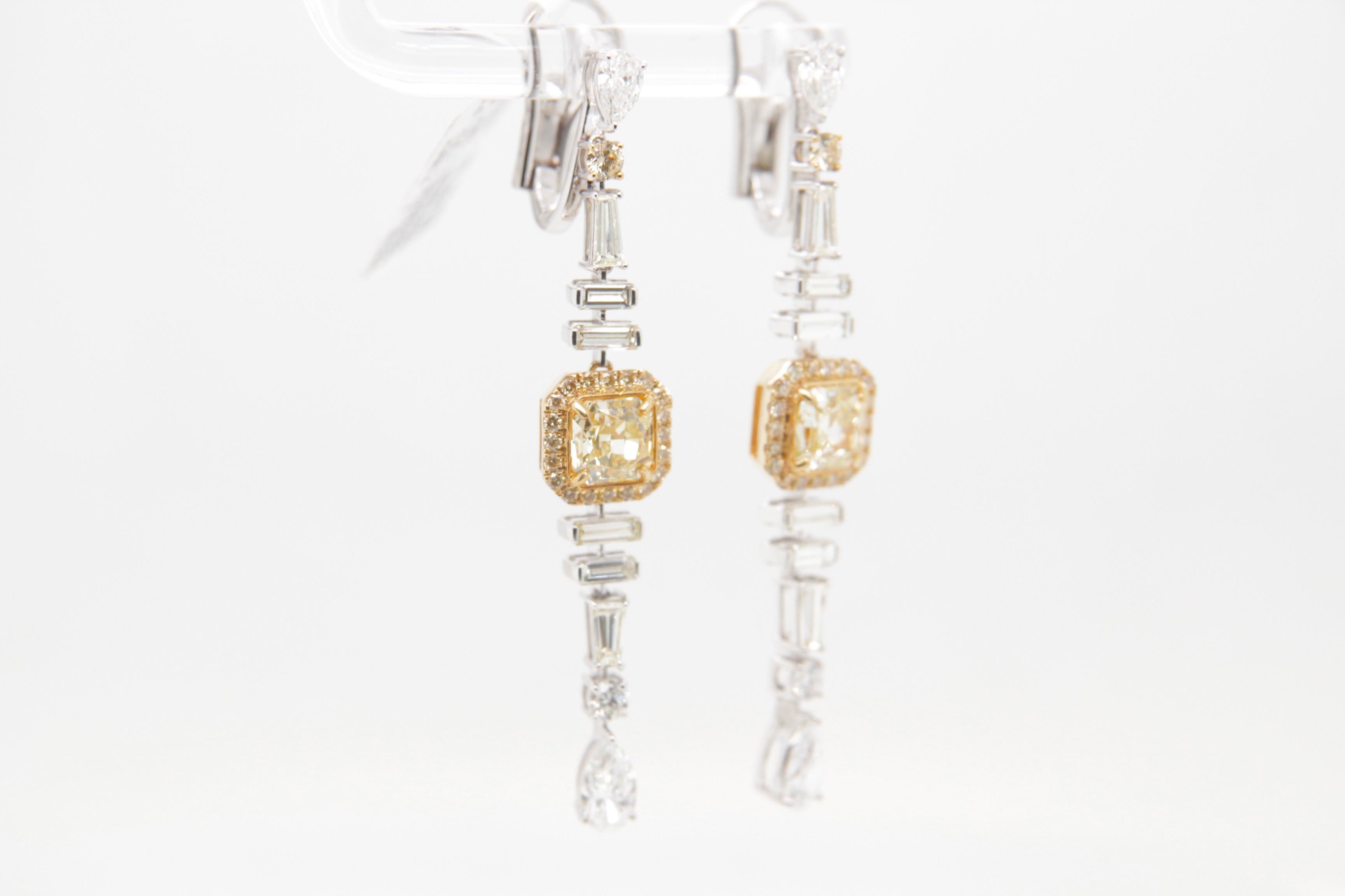 Radiant Cut GIA Certified 2.30 Carat Fancy Yellow Diamond Dangle Earrings in 18 Karat Gold For Sale