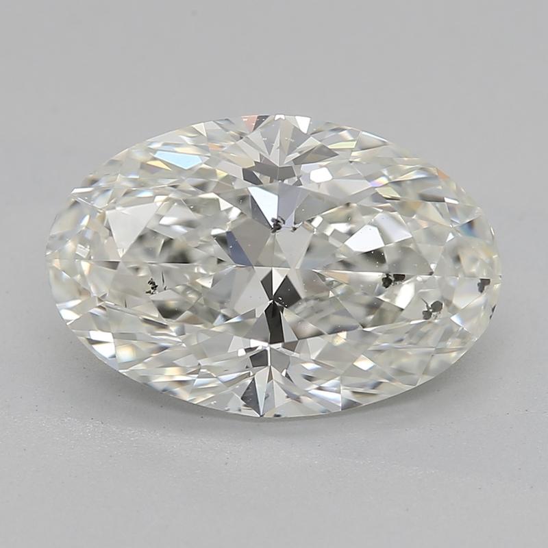 Experience the allure of this beautifully crafted diamond ring, showcasing a stunning oval diamond at its center, weighing 2.30 and radiating with a captivating J and SI2. The intricately designed setting features a delicate prong arrangement that