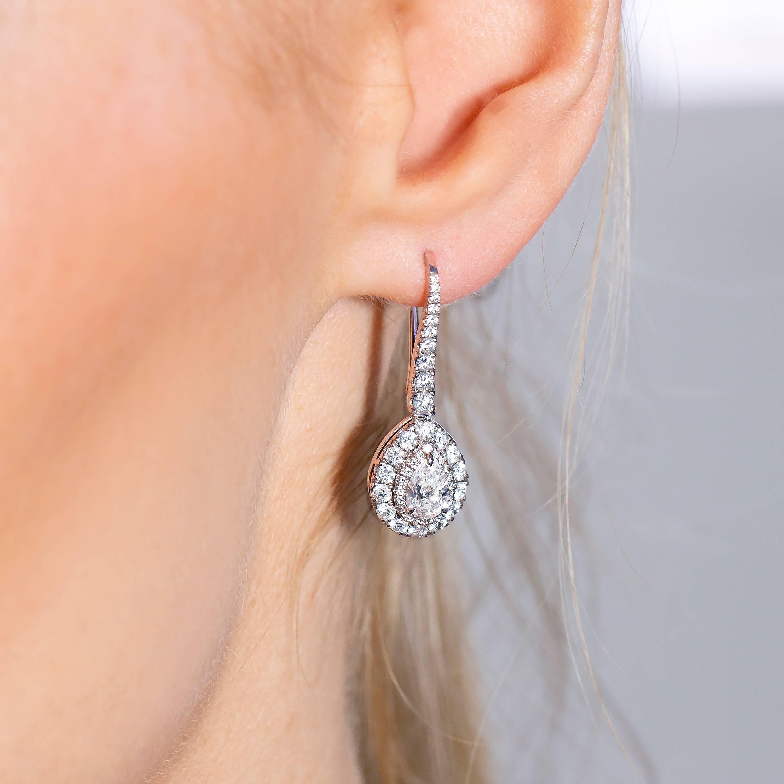 Women's GIA Certified 2.30 Carat Pear Shaped Platinum Diamond Drop Halo Modern Earrings For Sale