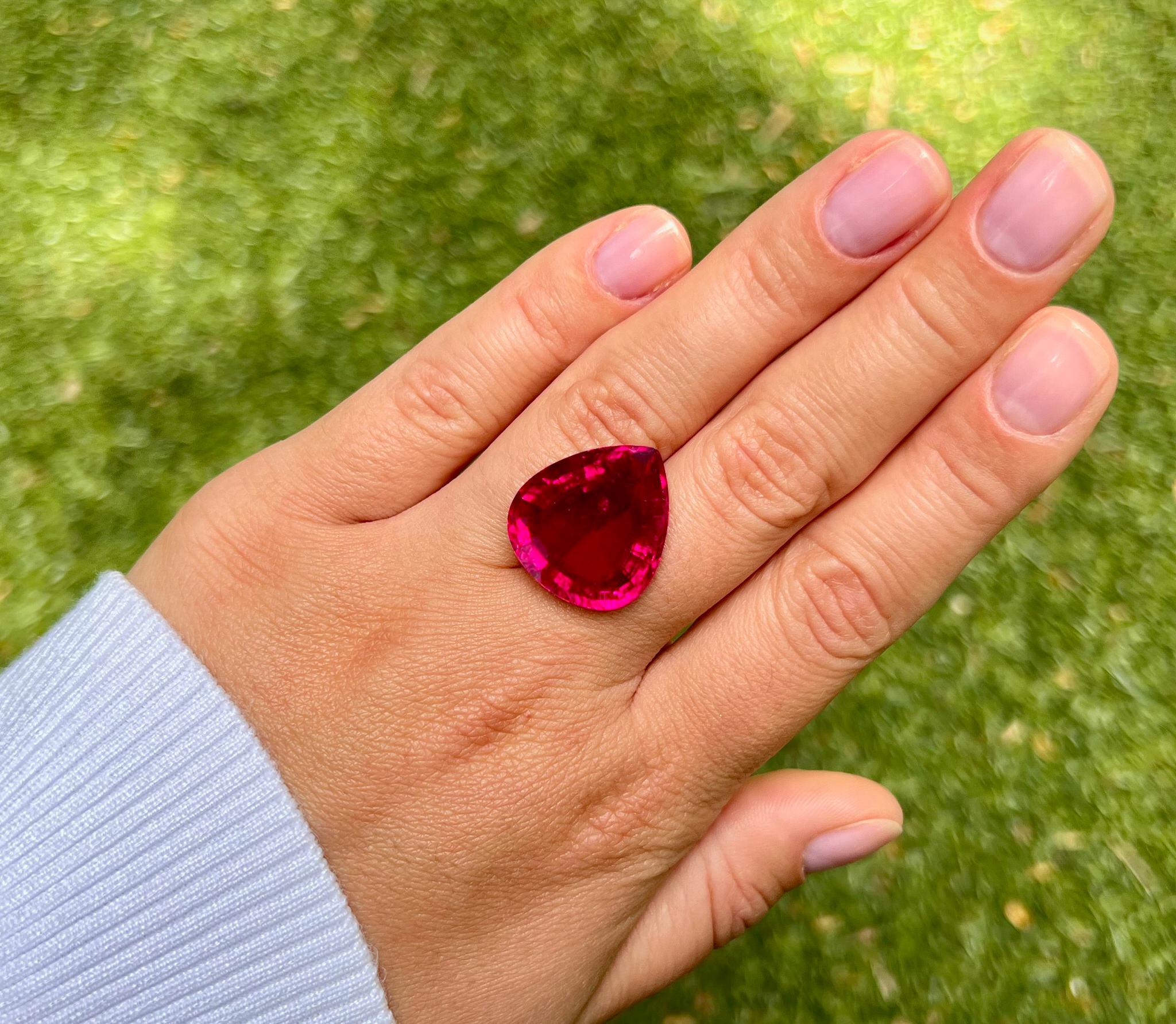 It comes with the GIA Certificate
Natural Rubellite Tourmaline
Carat Weight: 23.28 Carat
Color: Purple-Red
Cut: Pear
Measurements: 21.10 x 18.85 x 9.46 mm
It can be used for a custom jewelry piece, contact us for the details